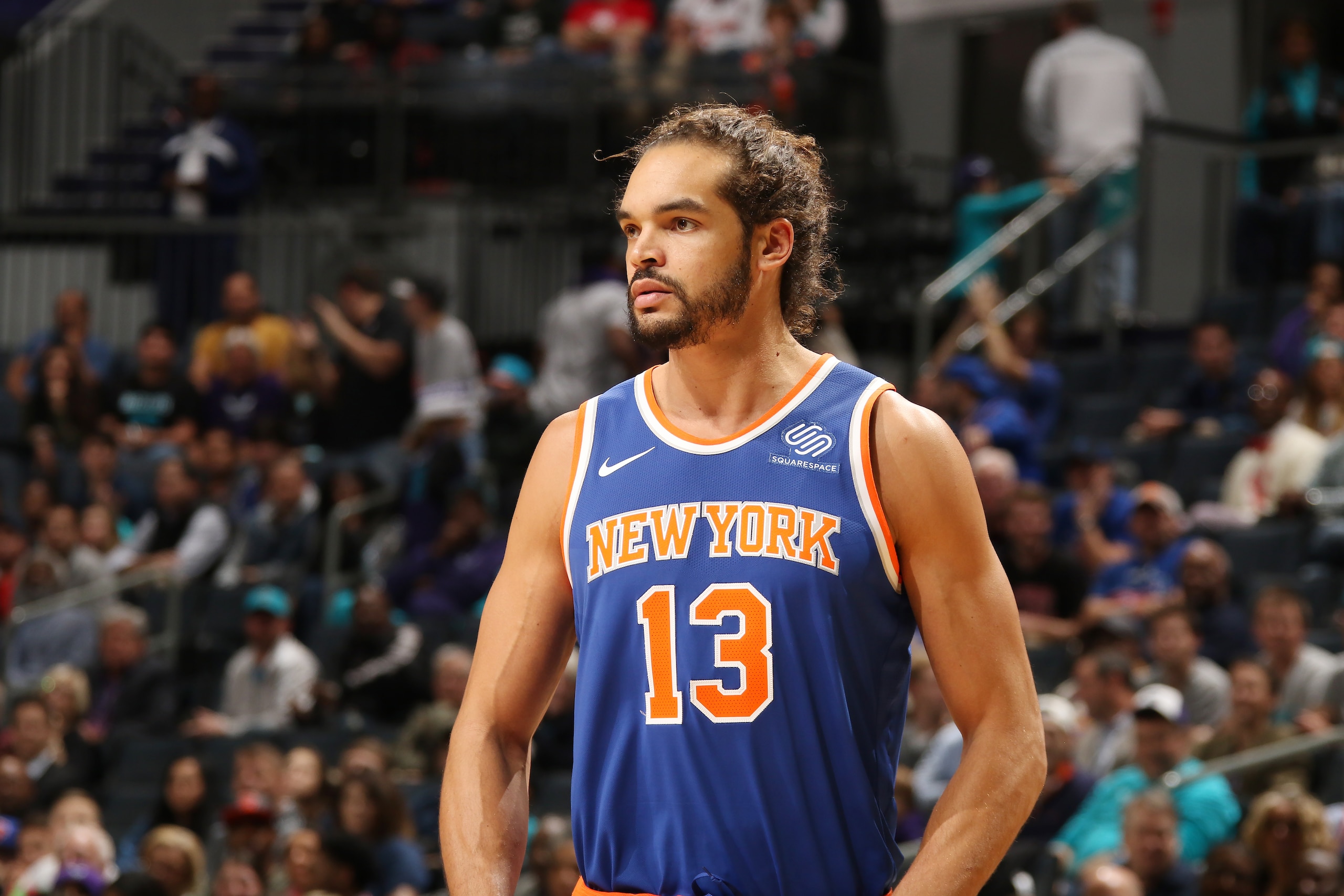 CHARLOTTE, NC - DECEMBER 18:  Joakim Noah #13 of the New York Knicks looks on during the game against the Charlotte Hornets on December 18, 2017 at Spectrum Center in Charlotte, North Carolina. NOTE TO USER: User expressly acknowledges and agrees that, by