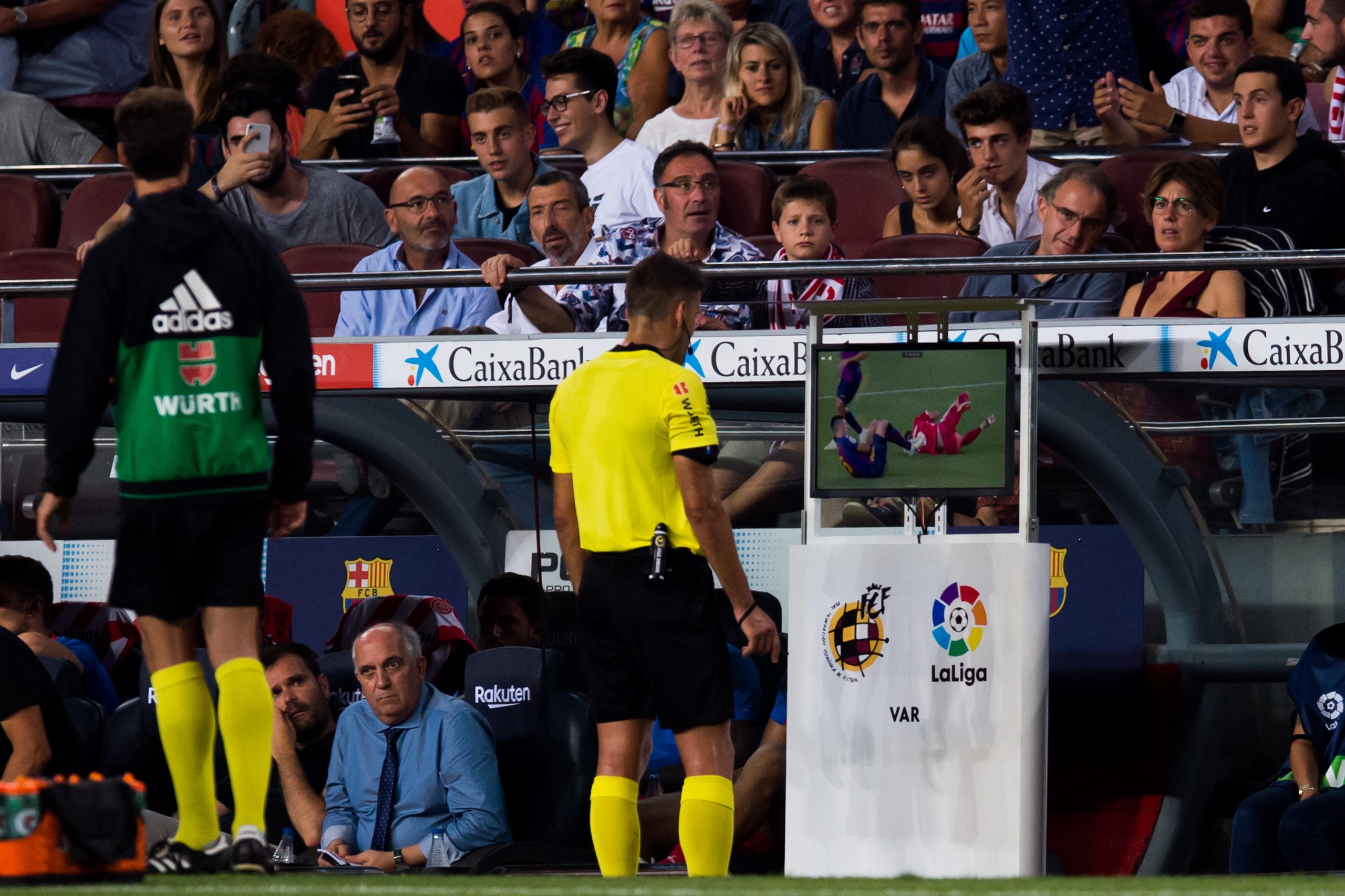 BARCELONA, SPAIN - SEPTEMBER 23: Referee Jesus Gil Manzano looks at the Video Assistant Referee VAR screen before showing a red card to Clement Lenglet of FC Barcelona during the La Liga match between FC Barcelona and Girona FC at Camp Nou on September 23