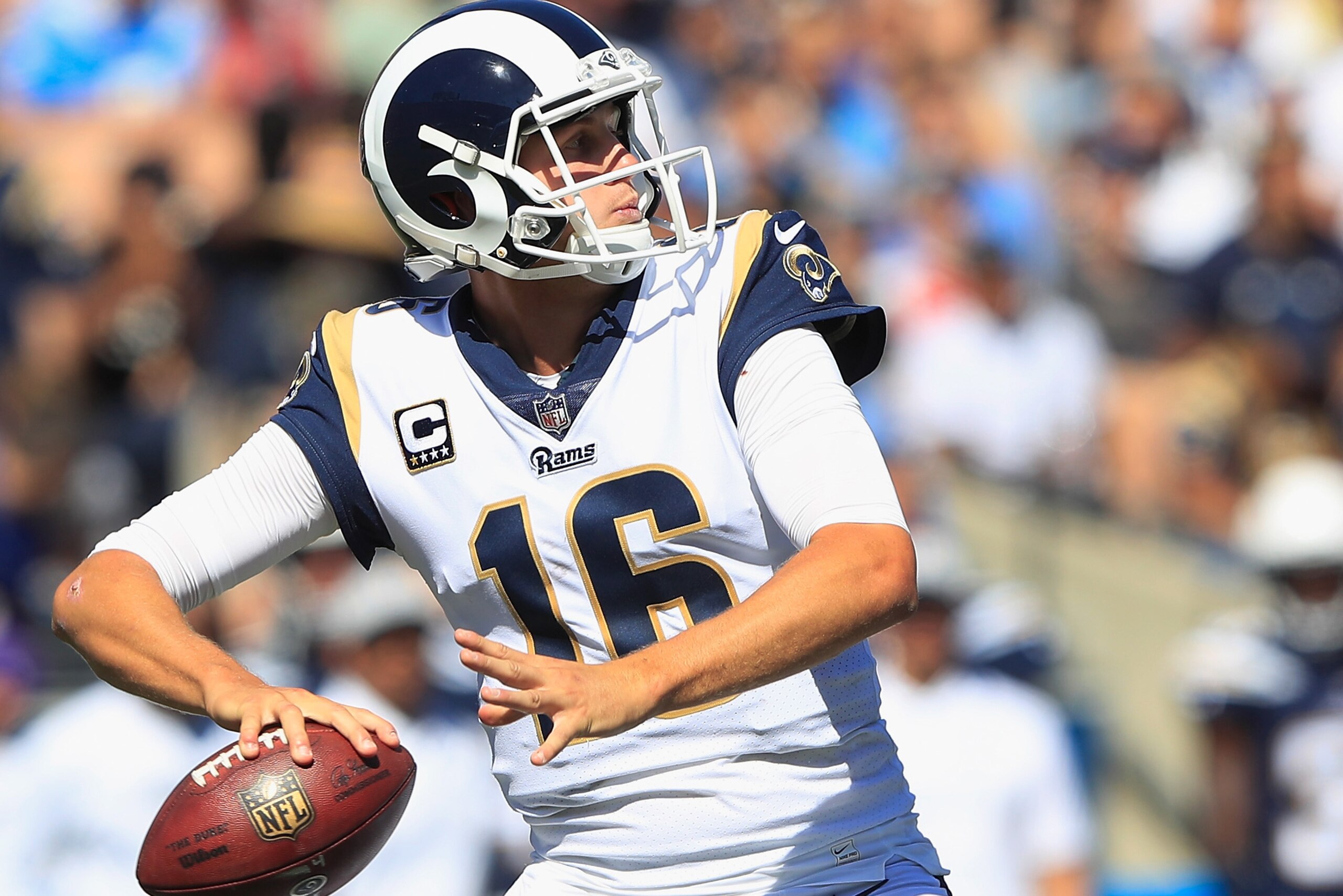 LOS ANGELES, CA - SEPTEMBER 23:  Quarterback Jared Goff #16 of the Los Angeles Rams looks to pass during the second quarter of the game against the Los Angeles Chargers at Los Angeles Memorial Coliseum on September 23, 2018 in Los Angeles, California.  (P