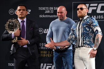 LAS VEGAS, NV - JANUARY 20:  UFC President Dana White squares off Rafael dos Anjos of Brazil (L) and Conor McGregor of Ireland (R) during the UFC 197 on-sale press conference event inside MGM Grand Hotel & Casino on January 20, 2016 in Las Vegas, Nevada. 