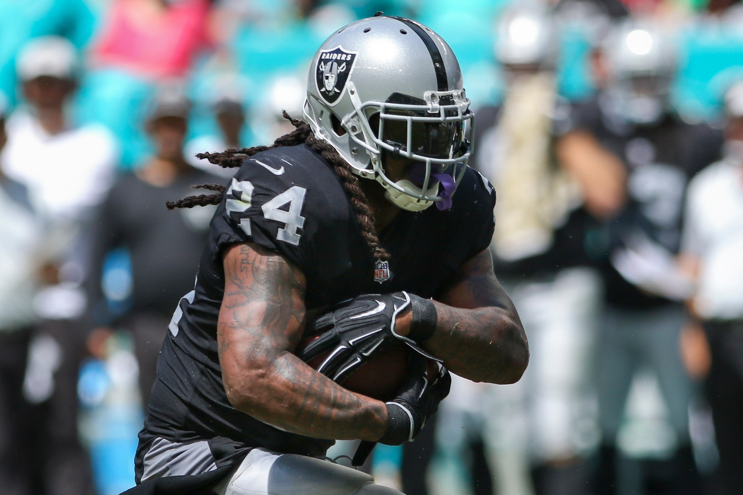 MIAMI, FL - SEPTEMBER 23: Marshawn Lynch #24 of the Oakland Raiders rushes for yardage during the second quarter against the Miami Dolphins at Hard Rock Stadium on September 23, 2018 in Miami, Florida. (Photo by Marc Serota/Getty Images)