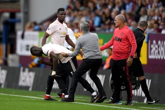 BURNLEY, ENGLAND - SEPTEMBER 02:  Jose Mourinho, Manager of Manchester United holds Eric Bailly of Manchester United as he replaces Paul Pogba of Manchester United during the Premier League match between Burnley FC and Manchester United at Turf Moor on Se