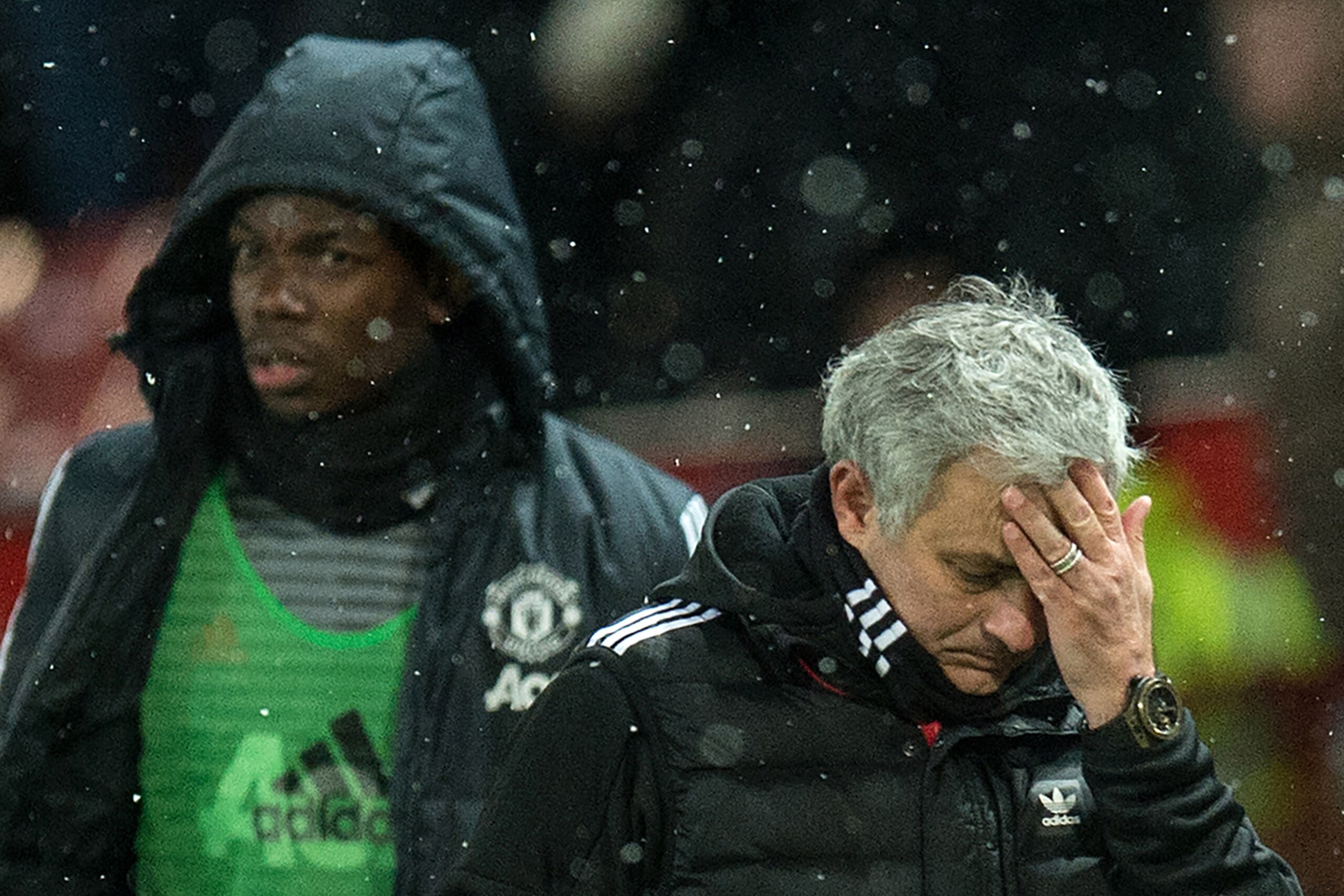 (FILES) in this March 17, 2018 file photo, Manchester United's Portuguese manager Jose Mourinho (R) and French midfielder Paul Pogba leave after the English FA Cup quarter-final football match between Manchester United and Brighton and Hove Albion at Old 