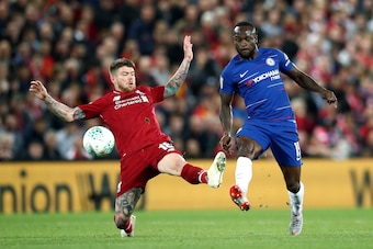 LIVERPOOL, ENGLAND - SEPTEMBER 26: Victor Moses of Chelsea is challenged by Alberto Moreno of Liverpool during the Carabao Cup Third Round match between Liverpool and Chelsea at Anfield on September 26, 2018 in Liverpool, England.  (Photo by Jan Kruger/Ge