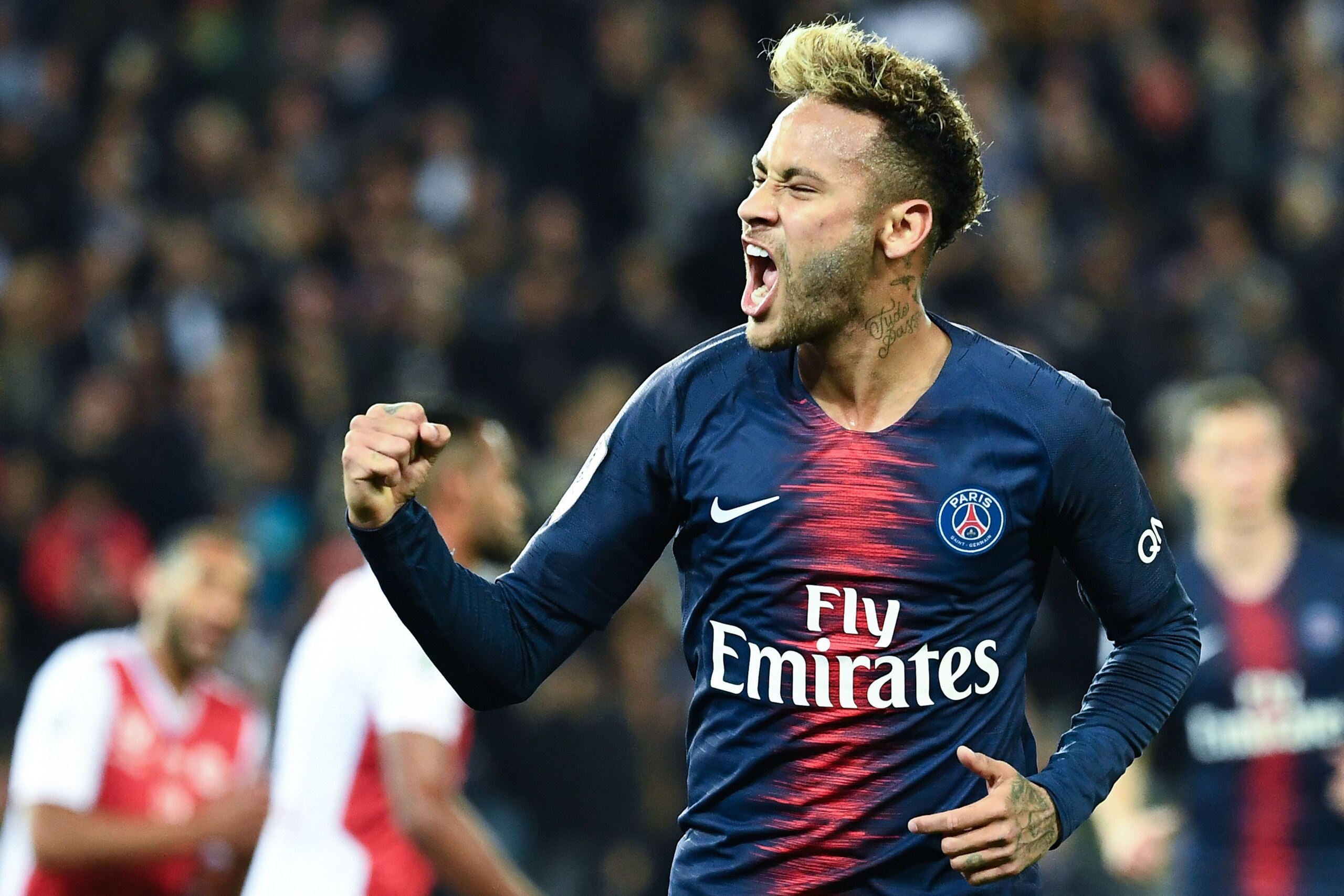 Paris Saint-Germain's Brazilian forward Neymar Jr celebrates after scoring a goal during the French L1 football match between Paris Saint Germain and Reims, on September 26, 2018 at the Parc des Princes stadium in Paris. (Photo by Anne-Christine POUJOULAT