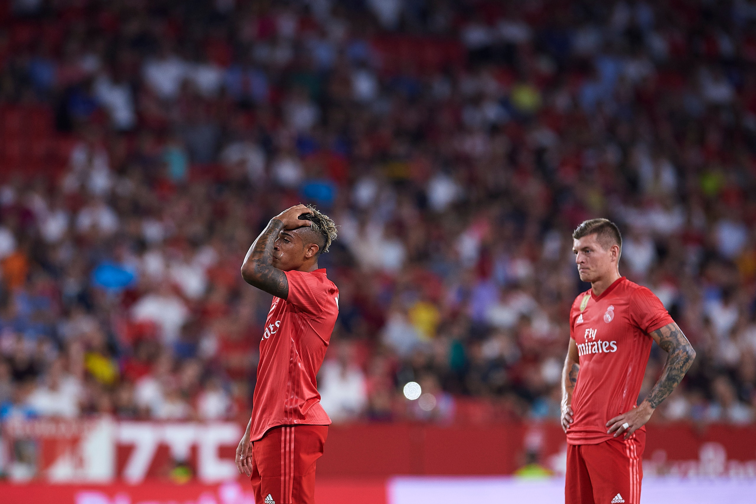 SEVILLE, SPAIN - SEPTEMBER 26: Mariano of Real Madrid CF and Toni Kroos of Real Madrid CF reacts during the La Liga match between Sevilla FC and Real Madrid CF at Estadio Ramon Sanchez Pizjuan on September 26, 2018 in Seville, Spain. (Photo by Aitor Alc SEVILLE, SPAIN - SEPTEMBER 26: Mariano of Real Madrid CF and Toni Kroos of Real Madrid CF reacts during the La Liga match between Sevilla FC and Real Madrid CF at Estadio Ramon Sanchez Pizjuan on September 26, 2018 in Seville, Spain. (Photo by Aitor Alc