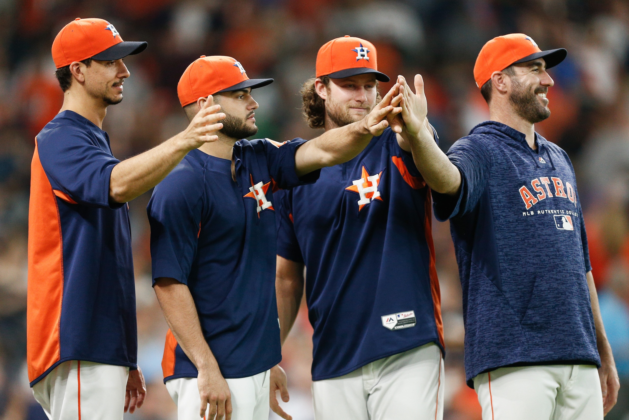 HOUSTON, TX - JULY 08:  (L-R) Charlie Morton #50 of the Houston Astros, Lance McCullers Jr. #43, Gerrit Cole #45 and Justin Verlander #35 wait to celebrate with the team after defeating the Chicago White Sox 2-1 at Minute Maid Park on July 8, 2018 in Hous