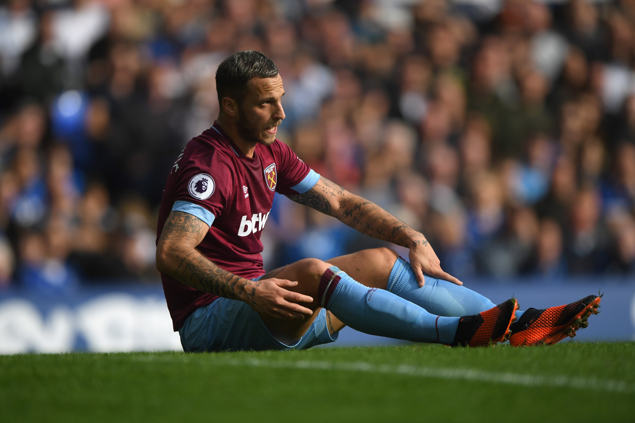 LIVERPOOL, ENGLAND - SEPTEMBER 16:  Marko Arnautovic of  West Ham looks on from the floor during the Premier League match between Everton FC and West Ham United at Goodison Park on September 16, 2018 in Liverpool, United Kingdom.  (Photo by Stu Forster/Ge