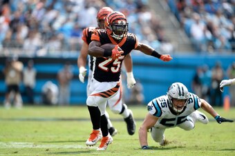 CHARLOTTE, NC - SEPTEMBER 23:  Giovani Bernard #25 of the Cincinnati Bengals runs the ball against David Mayo #55 of the Carolina Panthers in the second quarter during their game at Bank of America Stadium on September 23, 2018 in Charlotte, North Carolin