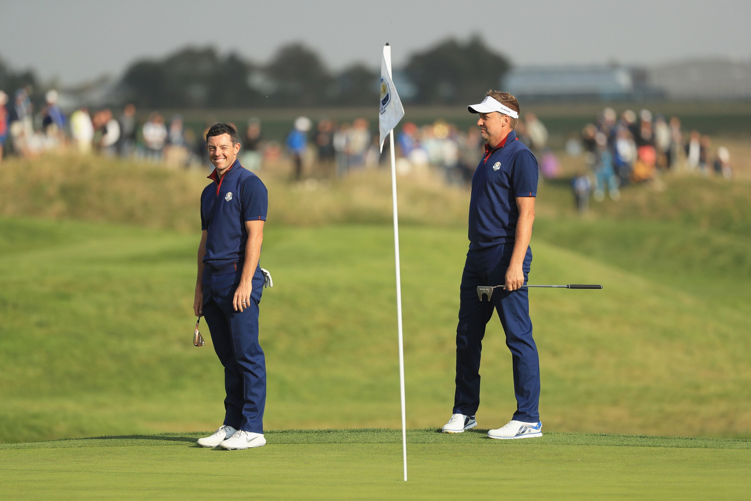 PARIS, FRANCE - SEPTEMBER 28:  Rory McIlroy of Europe celebrates with Ian Poulter of Europe during the afternoon foursome matches of the 2018 Ryder Cup at Le Golf National on September 28, 2018 in Paris, France.  (Photo by Mike Ehrmann/Getty Images)