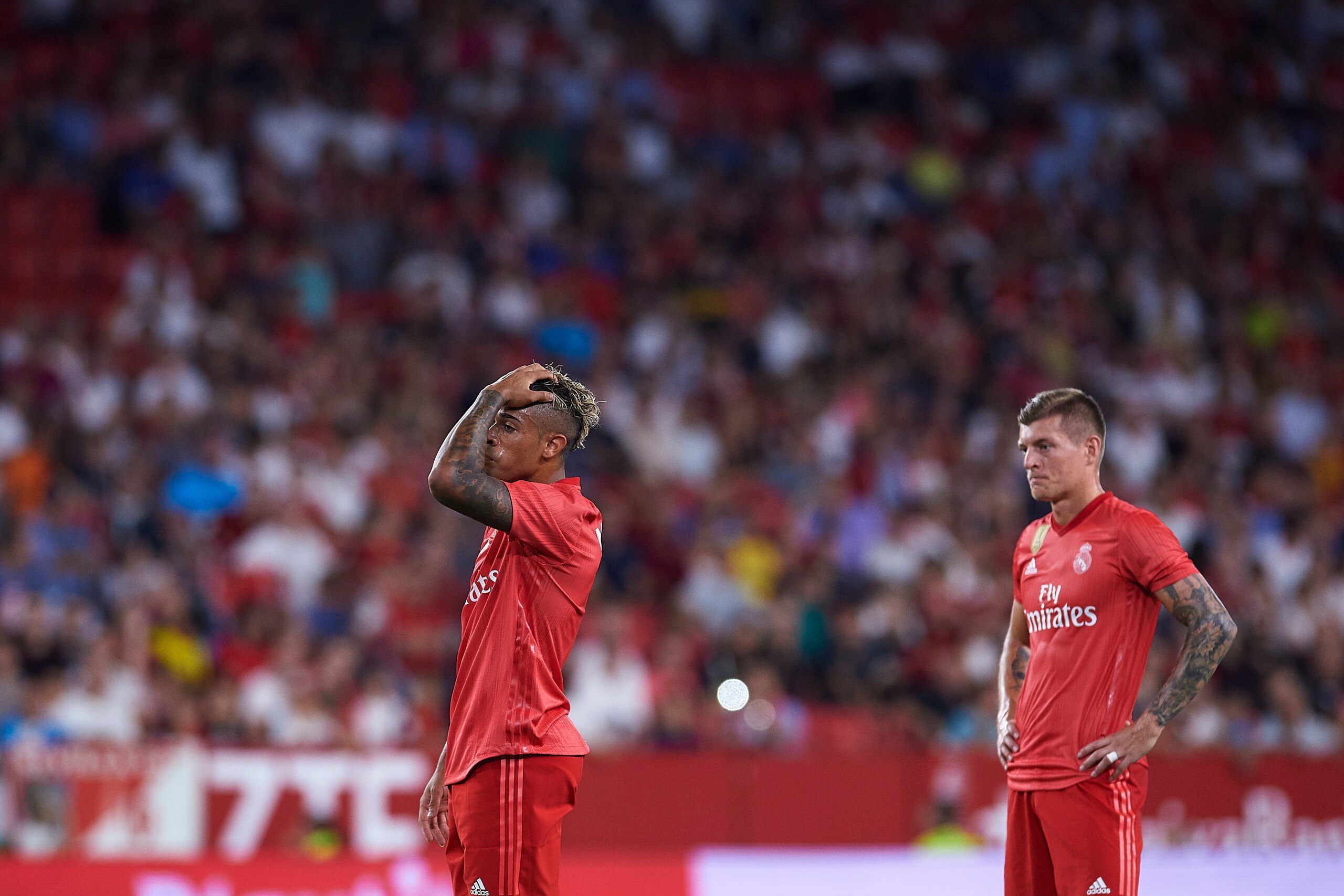 SEVILLE, SPAIN - SEPTEMBER 26:  Mariano of Real Madrid CF and Toni Kroos of Real Madrid CF reacts during the La Liga match between Sevilla FC and Real Madrid CF at Estadio Ramon Sanchez Pizjuan on September 26, 2018 in Seville, Spain.  (Photo by Aitor Alc
