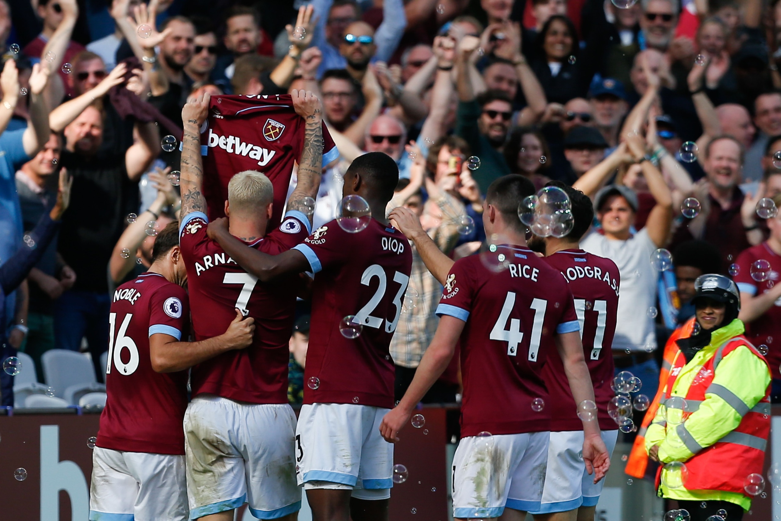 West Ham United's Austrian midfielder Marko Arnautovic (2L) celebrates after scoring their third goal during the English Premier League football match between West Ham United and Manchester United at The London Stadium, in east London on September 29, 201