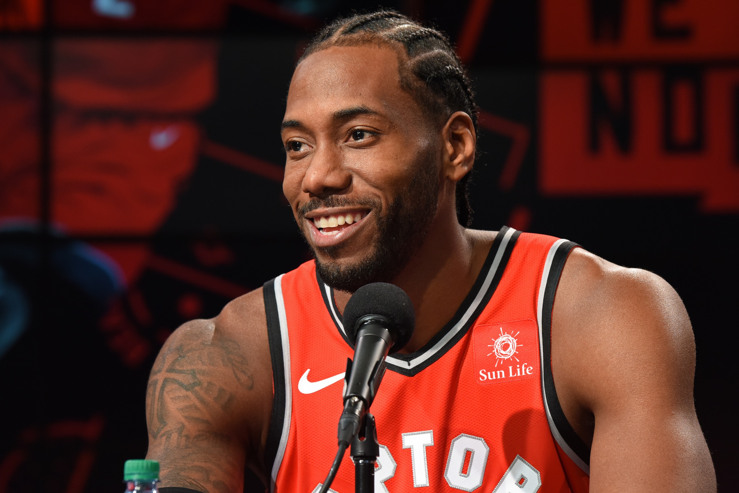 TORONTO, ON - SEPTEMBER 24: Kawhi Leonard #2 of the Toronto Raptors smiles at a press conference after media day on September 24, 2018 at the Air Canada Centre in Toronto, Ontario, Canada. NOTE TO USER: User expressly acknowledges and agrees that, by down TORONTO, ON - SEPTEMBER 24: Kawhi Leonard #2 of the Toronto Raptors smiles at a press conference after media day on September 24, 2018 at the Air Canada Centre in Toronto, Ontario, Canada. NOTE TO USER: User expressly acknowledges and agrees that, by down