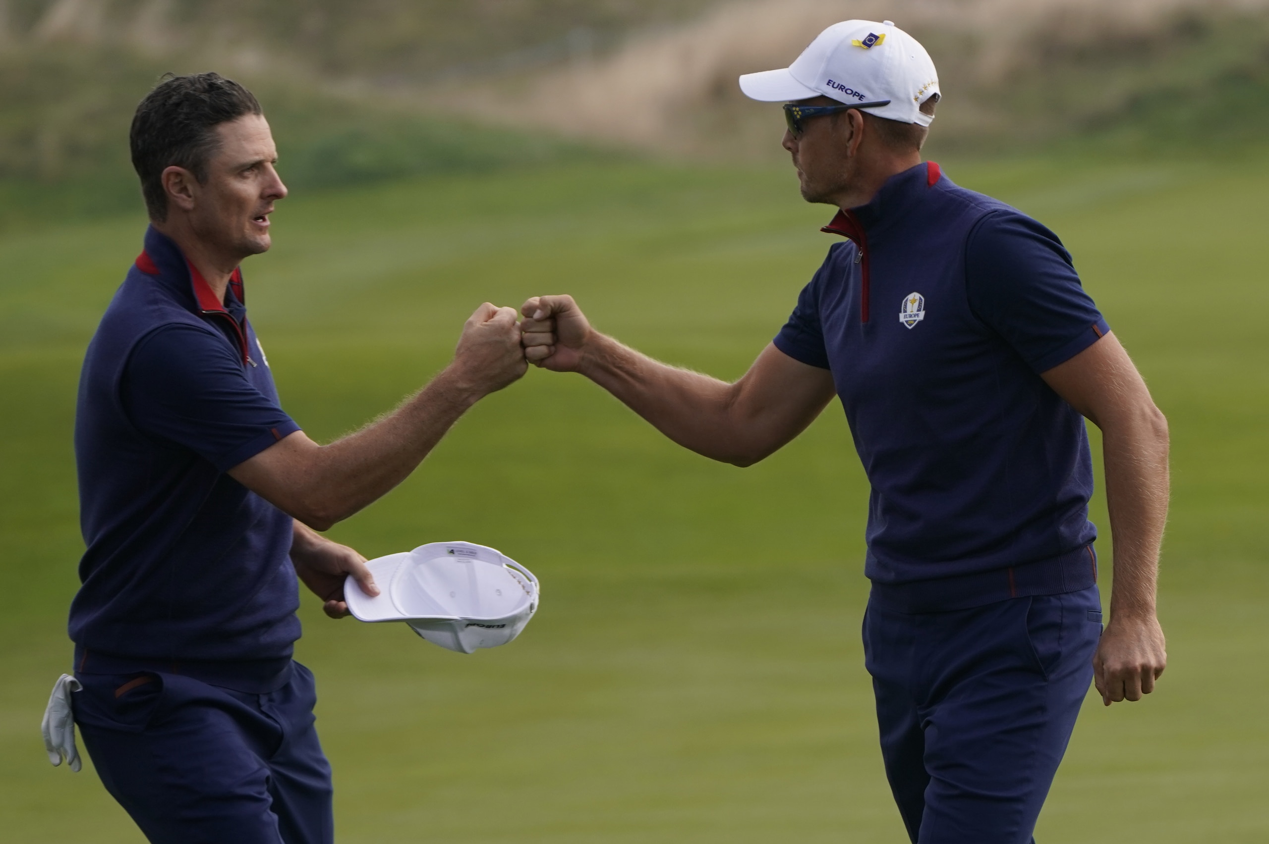 Europe's Swedish golfer Henrick Stenson (R) and Europe's English golfer Justin Rose celebrate during his foursomes match on the first day of the 42nd Ryder Cup at Le Golf National Course at Saint-Quentin-en-Yvelines, south-west of Paris on September 28, 2