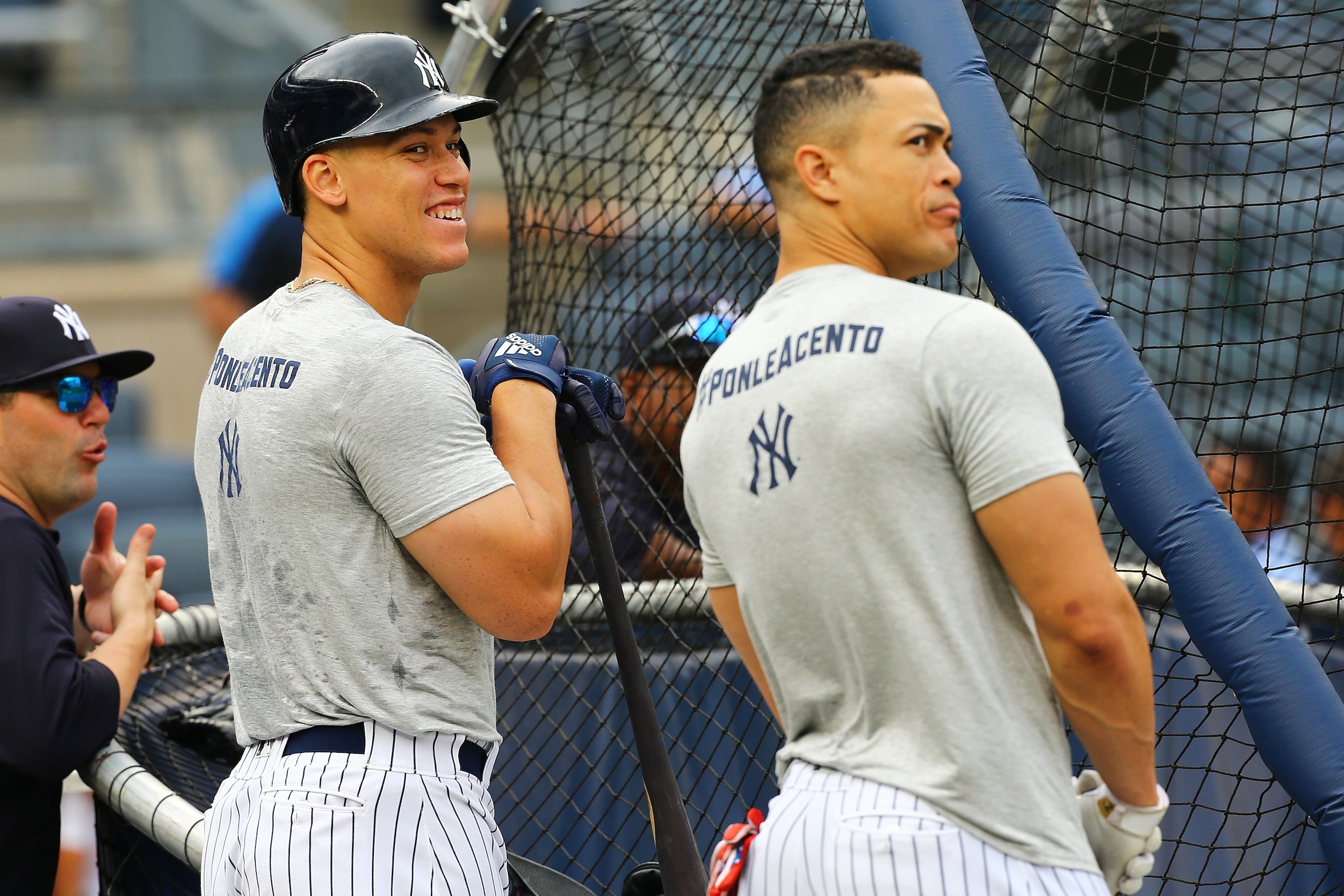 NEW YORK, NY - SEPTEMBER 14:  Aaron Judge #99 and Giancarlo Stanton #27 of the New York Yankees look on during batting practice prior to the game against the Toronto Blue Jays at Yankee Stadium on September 14, 2018 in the Bronx borough of New York City. 