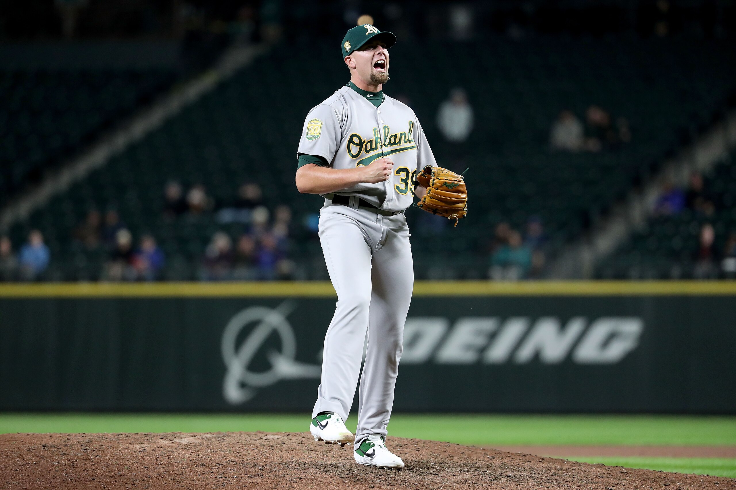 SEATTLE, WA - SEPTEMBER 24:  Blake Treinen #39 of the Oakland Athletics celebrates after defeating the Seattle Mariners 7-3 during their game at Safeco Field on September 24, 2018 in Seattle, Washington.  (Photo by Abbie Parr/Getty Images)