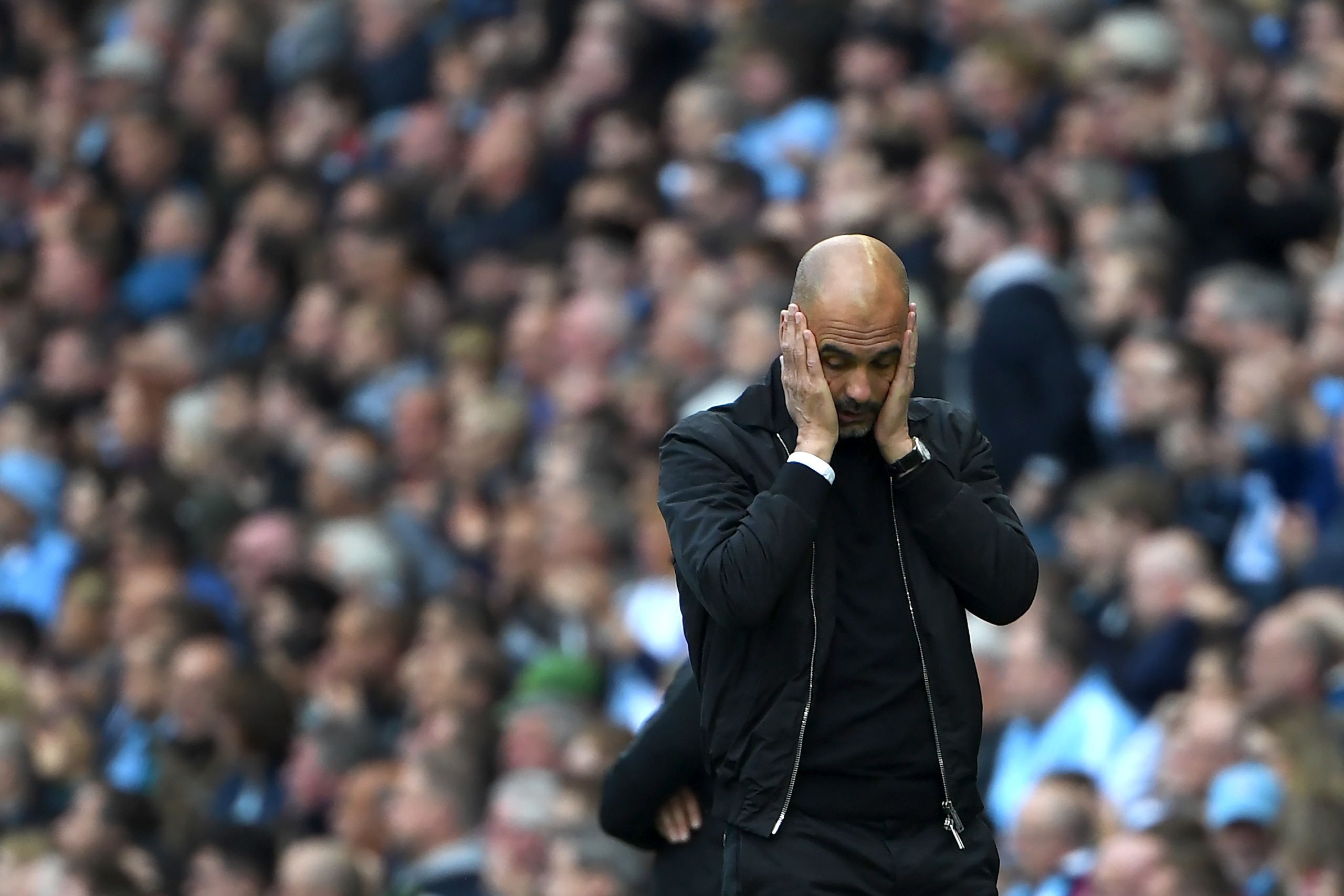 Manchester City's Spanish manager Pep Guardiola reacts during the English Premier League football match between Manchester City and Brighton and Hove Albion at the Etihad Stadium in Manchester, north west England, on September 29, 2018. (Photo by Paul ELL