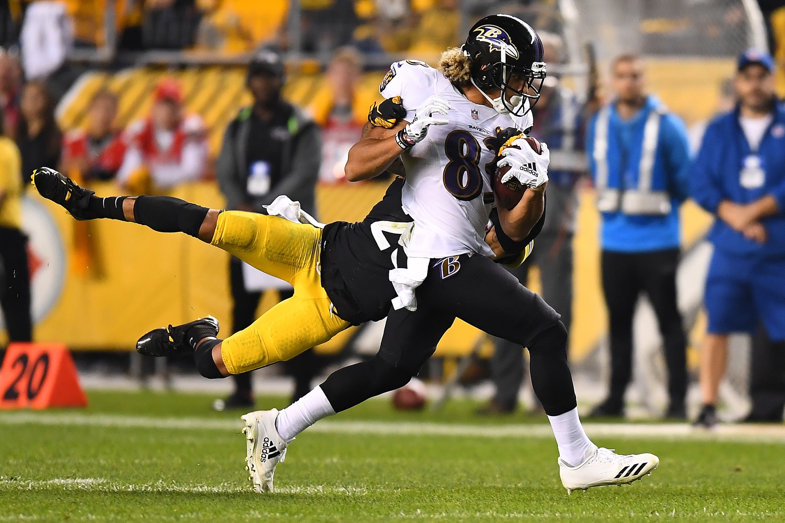 PITTSBURGH, PA - SEPTEMBER 30: Willie Snead #83 of the Baltimore Ravens runs upfield as Artie Burns #25 of the Pittsburgh Steelers attempts a tackle in the second half during the game at Heinz Field on September 30, 2018 in Pittsburgh, Pennsylvania. (Phot