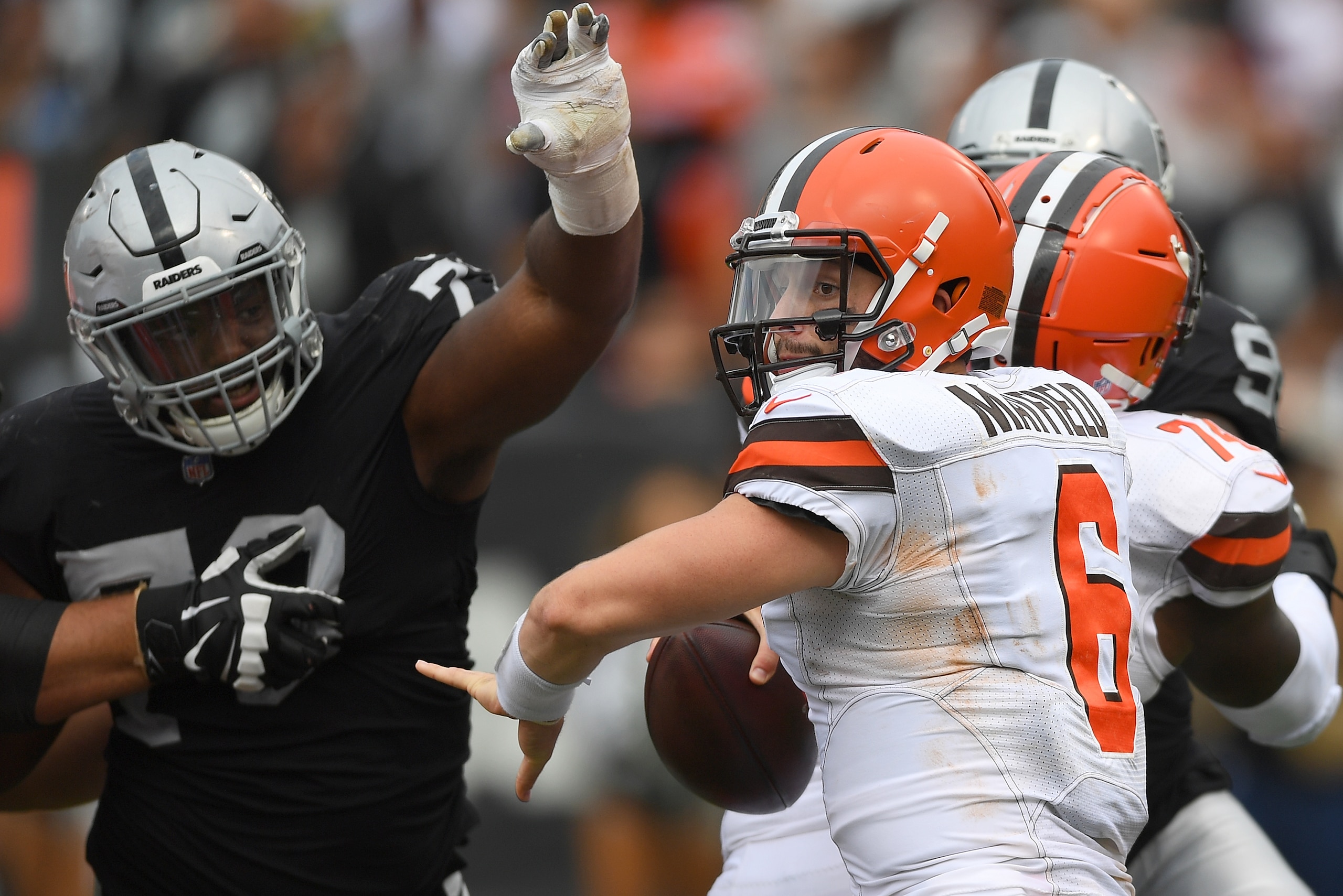 OAKLAND, CA - SEPTEMBER 30:  Maurice Hurst #73 of the Oakland Raiders puts pressure on quarterback Baker Mayfield #6 of the Cleveland Browns during the third quarter of their NFL football game at Oakland-Alameda County Coliseum on September 30, 2018 in Oa