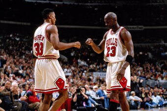 CHICAGO - MAY 3: Michael Jordan #23 of the Chicago Bulls celebrates with Scottie Pippen #33 of the Chicago Bulls during a game played on May 3, 1998 at the United Center in Chicago, Illinois.  NOTE TO USER: User expressly acknowledges and agrees that, by 