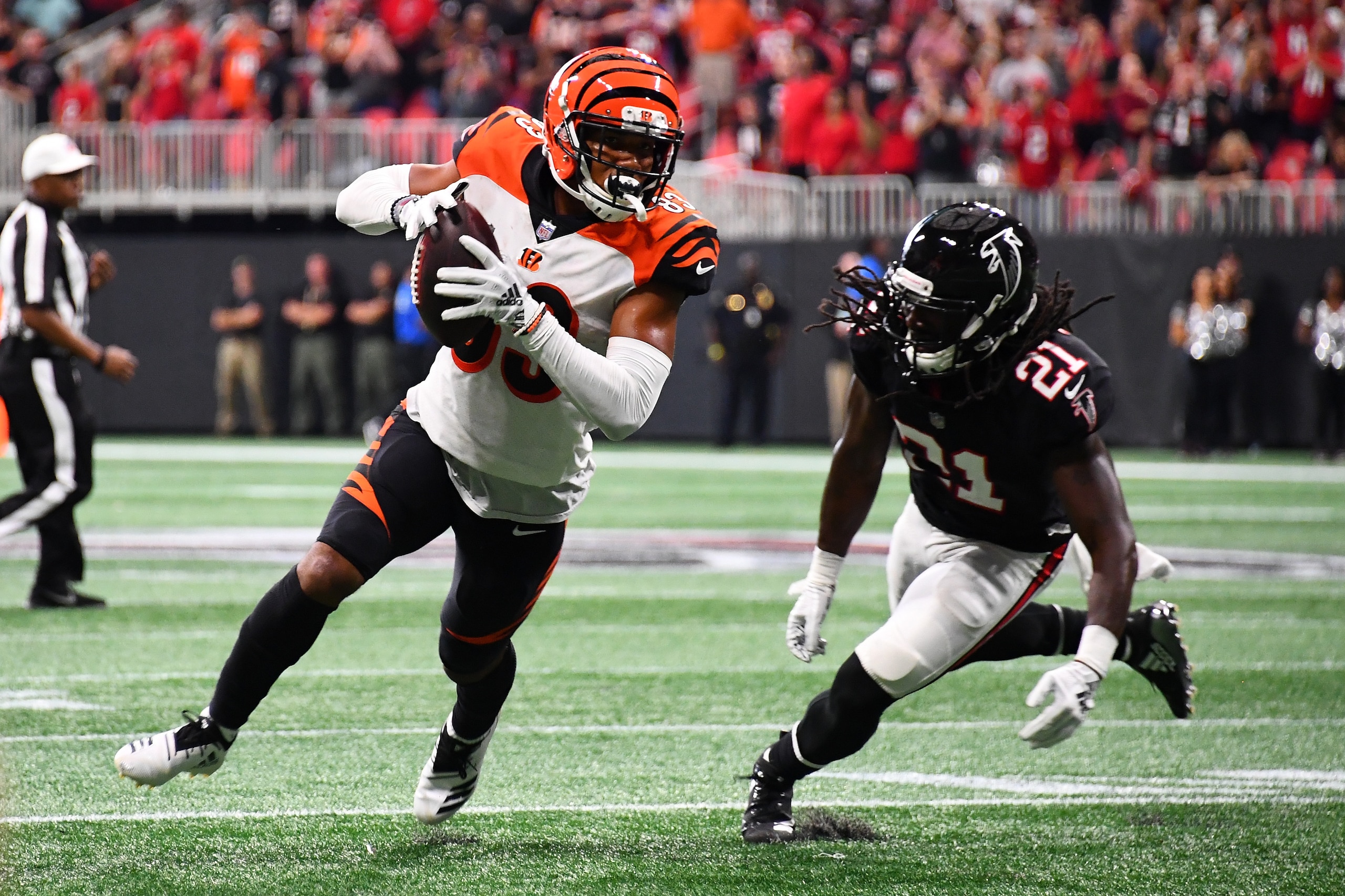 ATLANTA, GA - SEPTEMBER 30: Tyler Boyd #83 of the Cincinnati Bengals runs past Desmond Trufant #21 of the Atlanta Falcons after a catch during the third quarter at Mercedes-Benz Stadium on September 30, 2018 in Atlanta, Georgia. (Photo by Scott Cunningham ATLANTA, GA - SEPTEMBER 30: Tyler Boyd #83 of the Cincinnati Bengals runs past Desmond Trufant #21 of the Atlanta Falcons after a catch during the third quarter at Mercedes-Benz Stadium on September 30, 2018 in Atlanta, Georgia. (Photo by Scott Cunningham