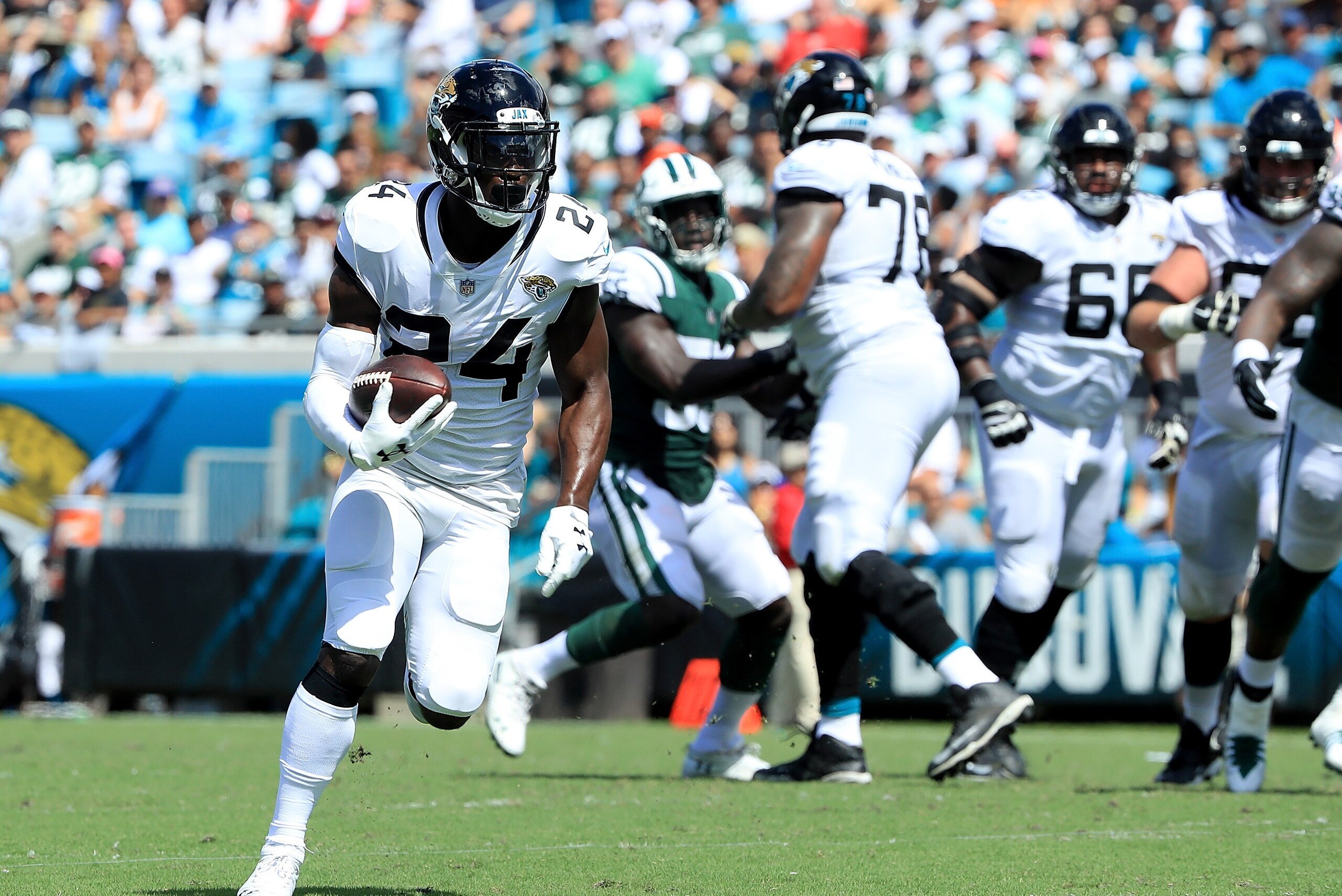 JACKSONVILLE, FL - SEPTEMBER 30:  T.J. Yeldon #24 of the Jacksonville Jaguars runs for yardage during the game against the New York Jets on September 30, 2018 in Jacksonville, Florida.  (Photo by Sam Greenwood/Getty Images)