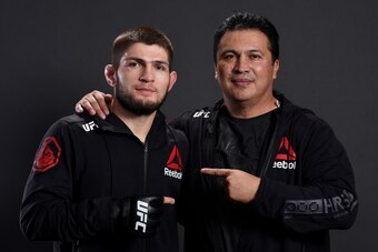 LAS VEGAS, NV - DECEMBER 30:  Khabib Nurmagomedov of Russia poses for a portrait backstage with coach Javier Mendez after his victory over Edson Barboza during the UFC 219 event inside T-Mobile Arena on December 30, 2017 in Las Vegas, Nevada. (Photo by Mi