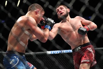 NEW YORK, NY - APRIL 07: Khabib Nurmagomedov (R) lands a right uppercut on Al Iaquinta (L) during their UFC lightweight championship bout at UFC 223 at Barclays Center on April 7, 2018 in New York City. (Photo by Ed Mulholland/Getty Images)