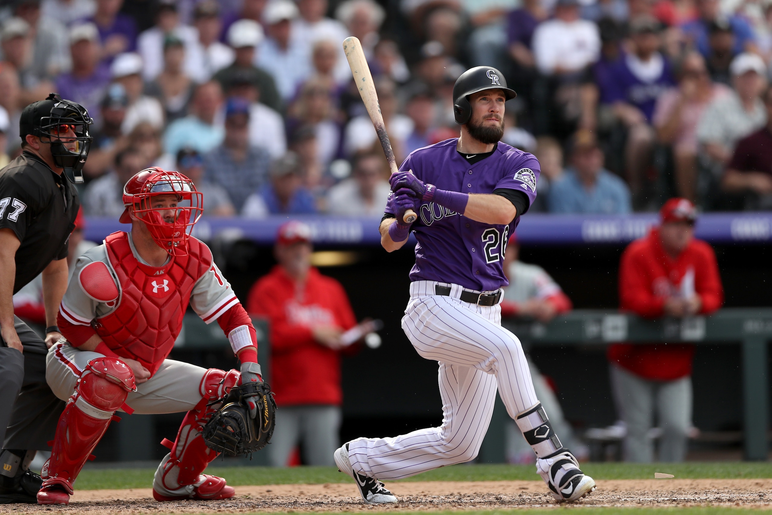 DENVER, CO - SEPTEMBER 27:  David Dahl #26 of the Colorado Rockies hits a RBI triple in the seventh inning against the Philadelphia Phillies at Coors Field on September 27, 2018 in Denver, Colorado.  (Photo by Matthew Stockman/Getty Images)