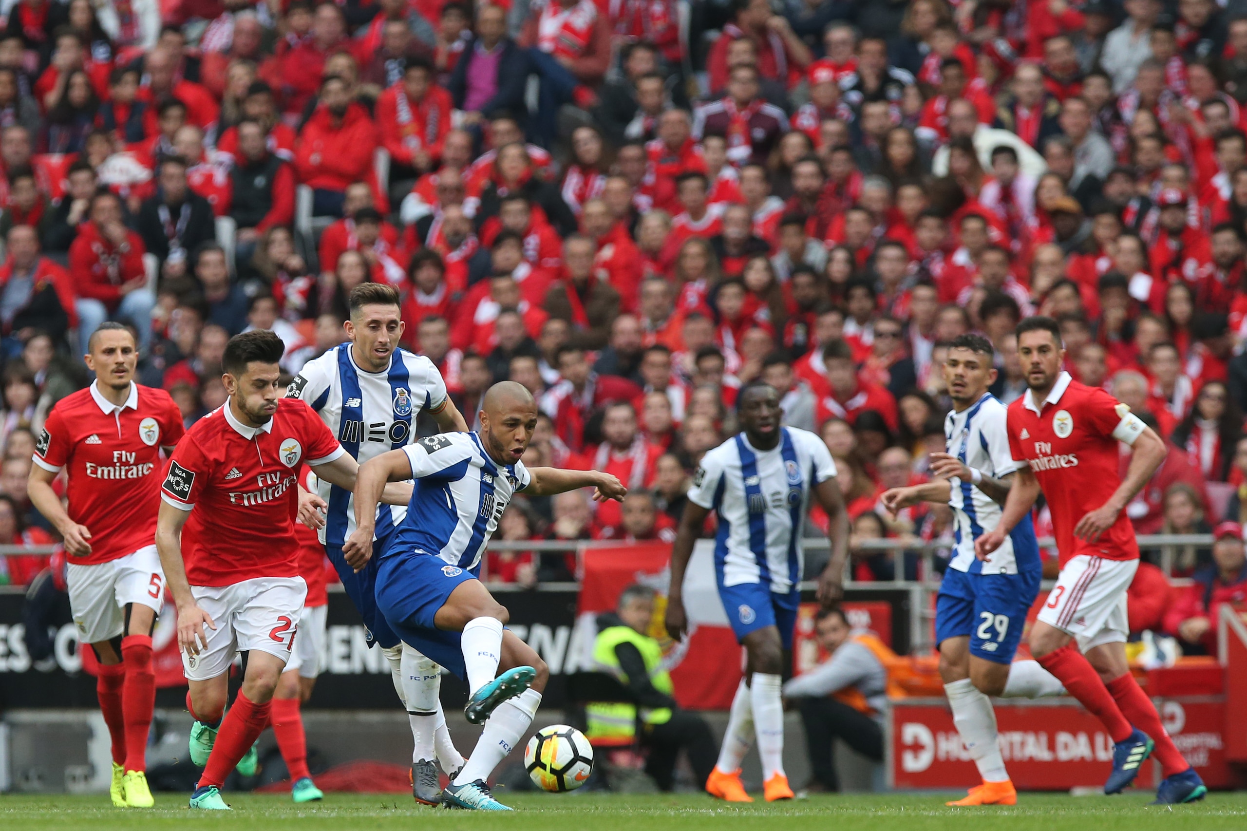 LISBON, PORTUGAL - APRIL 15: FC Porto forward Yacine Brahimi from Algeria with SL Benfica forward Pizzi from Portugal in action during the Primeira Liga match between SL Benfica and FC Porto at Estadio da Luz on April 15, 2018 in Lisbon, Portugal.  (Photo