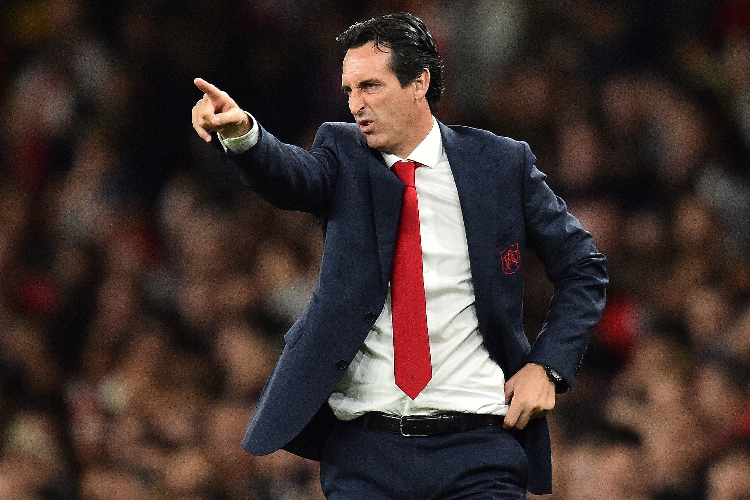 Arsenal's Spanish head coach Unai Emery shouts instructions to his players from the touchline during the English League Cup third round football match between Arsenal and Brentford at the Emirates Stadium in London on September 26, 2018. (Photo by Glyn KI