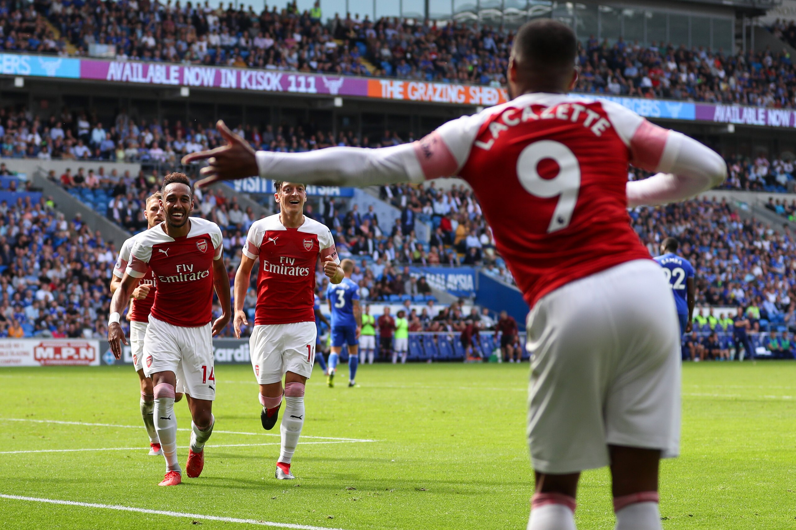 CARDIFF, WALES - SEPTEMBER 02: Pierre-Emerick Aubameyang of Arsenal celebrates after scoring his teams second goal by running to Alexandre Lacazette of Arsenal during the Premier League match between Cardiff City and Arsenal FC at Cardiff City Stadium on 