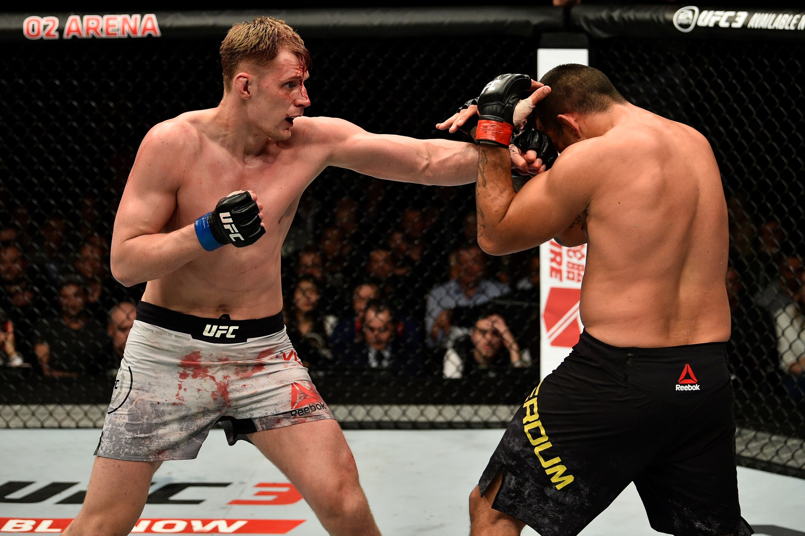 LONDON, ENGLAND - MARCH 17:  (L-R) Alexander Volkov of Russia punches Fabricio Werdum of Brazil in their heavyweight bout inside The O2 Arena on March 17, 2018 in London, England. (Photo by Brandon Magnus/Zuffa LLC/Zuffa LLC via Getty Images)