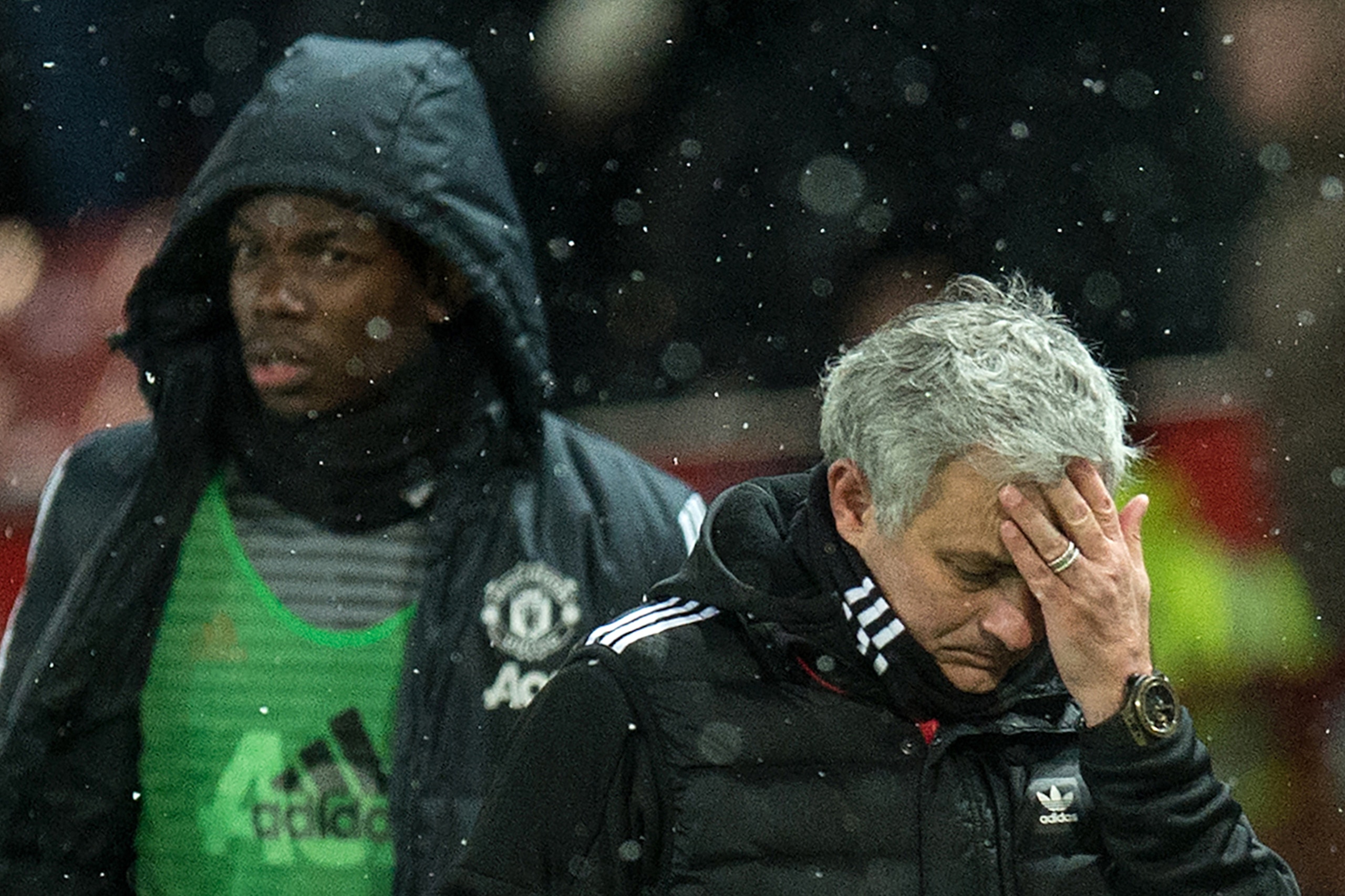 (FILES) in this March 17, 2018 file photo, Manchester United's Portuguese manager Jose Mourinho (R) and French midfielder Paul Pogba leave after the English FA Cup quarter-final football match between Manchester United and Brighton and Hove Albion at Old 