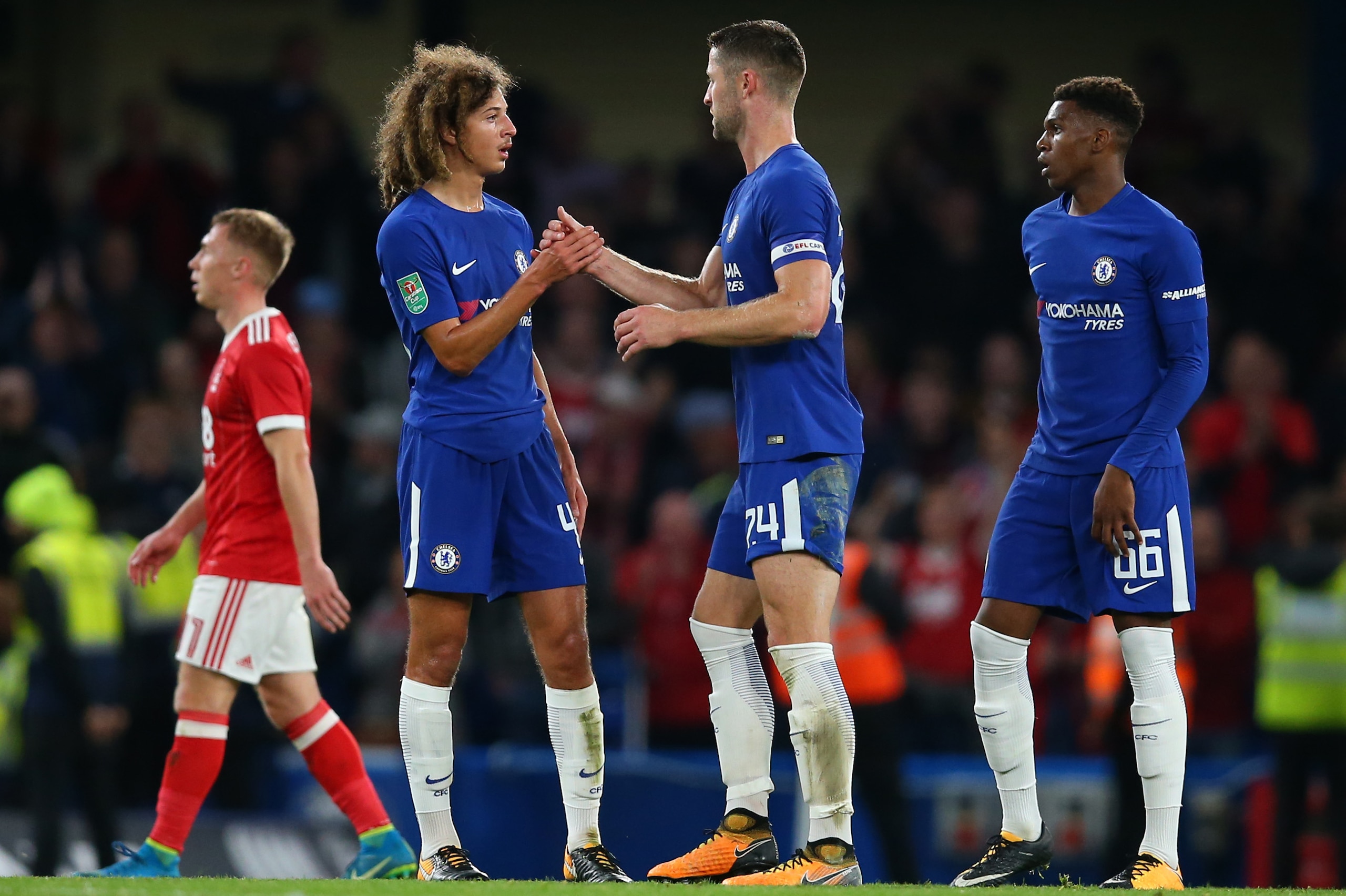 LONDON, ENGLAND - SEPTEMBER 20: Gary Cahill of Chelsea shakes hands with Ethan Ampadu and Dujon Sterling of Chelsea during the Carabao Cup Third Round match between Chelsea and Nottingham Forest at Stamford Bridge on September 20, 2017 in London, England.