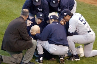 The Yankees tend to Don Zimmer after his tussle with Pedro Martinez in the 2003 ALCS.