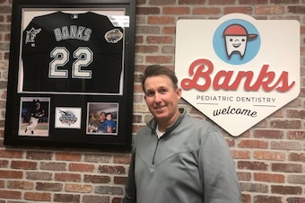 Brian Banks and his Marlins World Series jersey greet his young patients now in Mesa, Arizona, 15 years after his pinch-hit walk sparked the Marlins to rally past the Cubs in Game 7 of the 2003 NLCS.