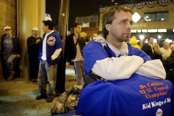 CHICAGO - OCTOBER 15:  A somber Ted Zegarski hangs out with others Chicago Cubs fans in front of Wrigley Field near the end of the game as the Chicago Cubs were defeated 9-6 by the Florida Marlins in game 7 of the National League Championship Series Octob