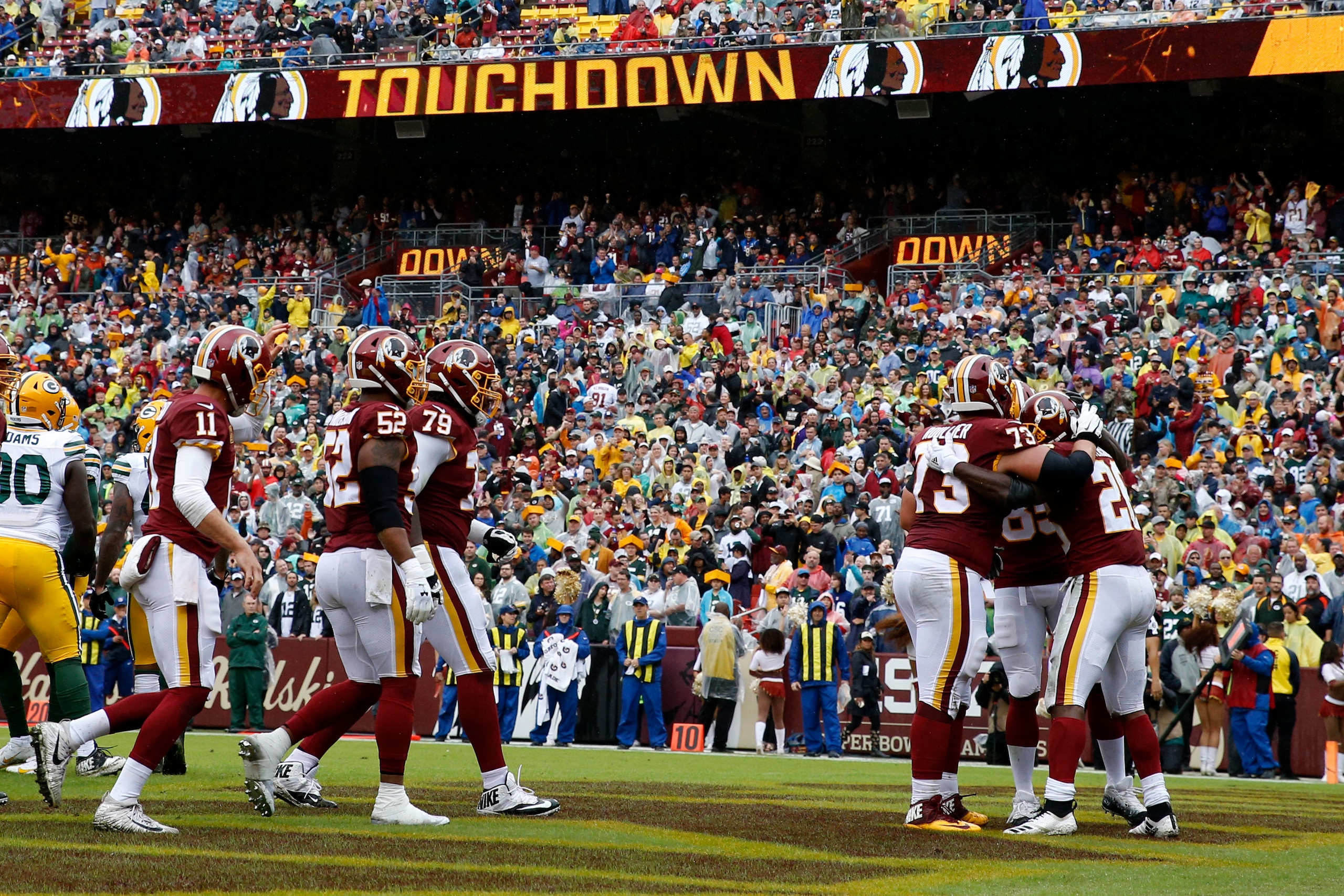 LANDOVER, MD - SEPTEMBER 23: Adrian Peterson #26 of the Washington Redskins celebrates with teammates after a first quarter touchdown against the Green Bay Packers at FedExField on September 23, 2018 in Landover, Maryland. (Photo by Todd Olszewski/Getty I