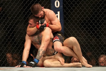 LAS VEGAS, NV - OCTOBER 06:  Conor McGregor of Ireland is held by Khabib Nurmagomedov of Russia before submitting in defeat in their UFC lightweight championship bout during the UFC 229 event inside T-Mobile Arena on October 6, 2018 in Las Vegas, Nevada. 