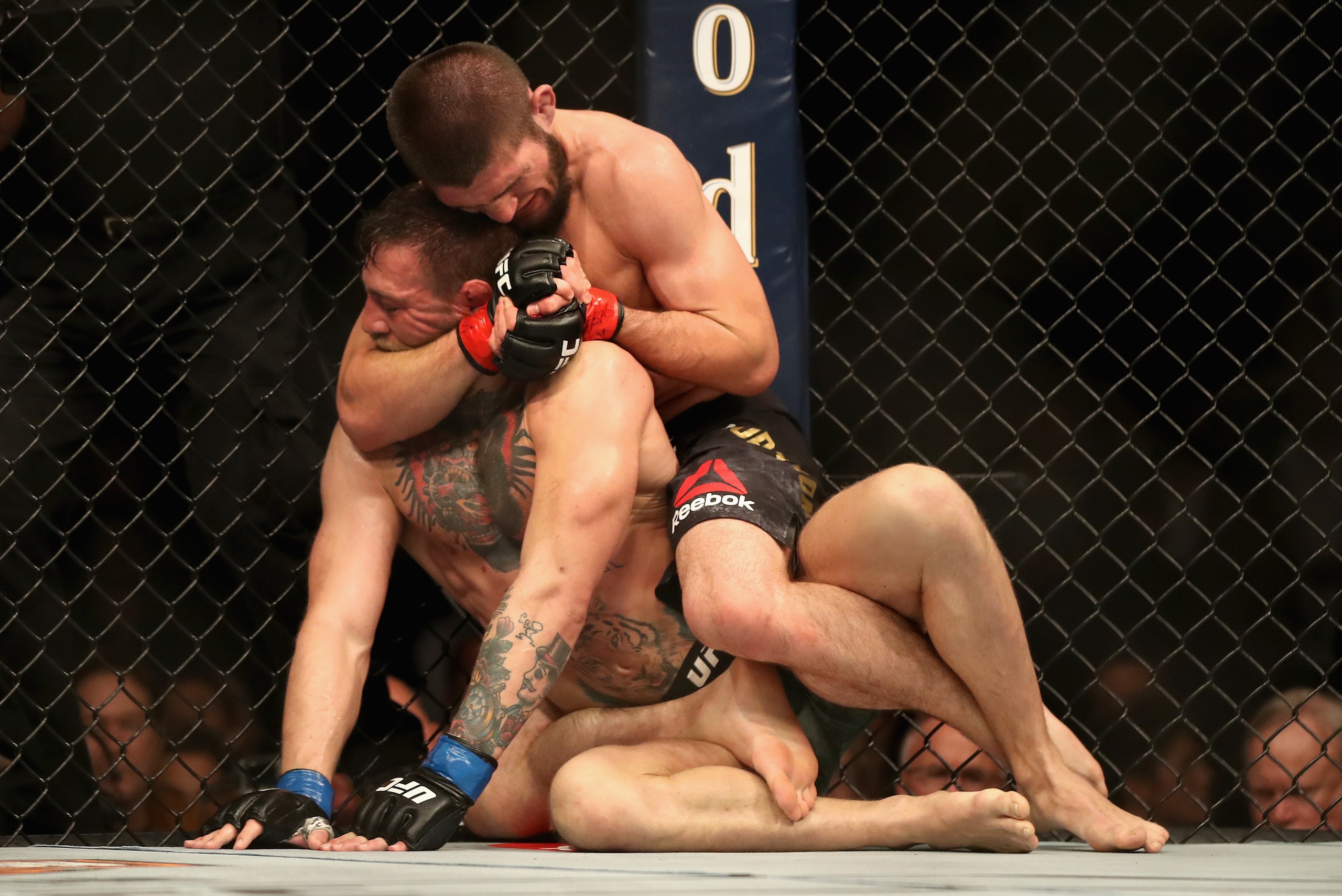 LAS VEGAS, NV - OCTOBER 06:  Conor McGregor of Ireland is held by Khabib Nurmagomedov of Russia before submitting in defeat in their UFC lightweight championship bout during the UFC 229 event inside T-Mobile Arena on October 6, 2018 in Las Vegas, Nevada. 