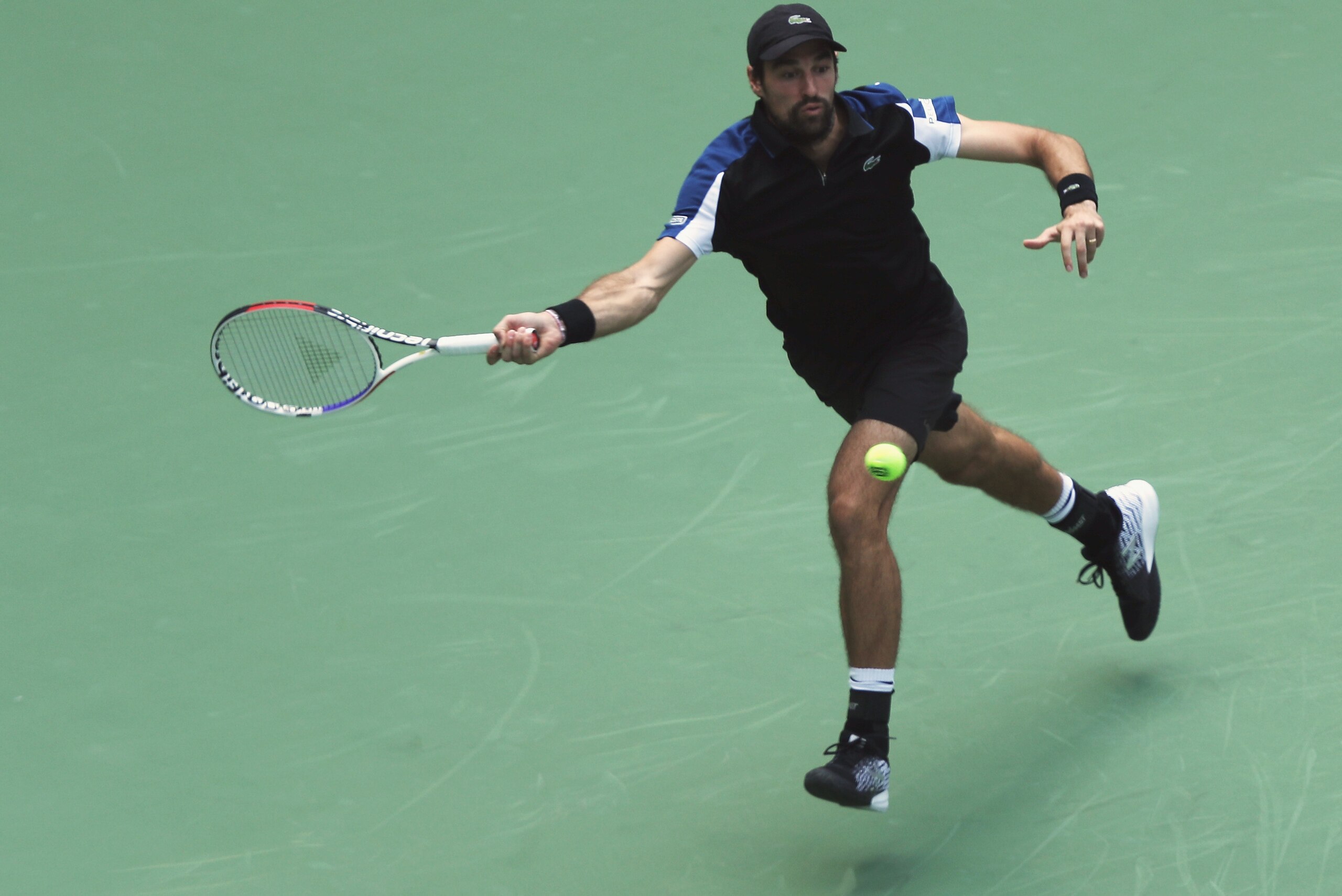 SHANGHAI, CHINA - OCTOBER 07:  Jeremy Chardy of France returns a shot to Maximillian Marterer of Germany during their match in 2018 Rolex Shanghai Masters on Day 1 at Qi Zhong Tennis Centre on October 7, 2018 in Shanghai, China.  (Photo by Kevin Lee/Getty