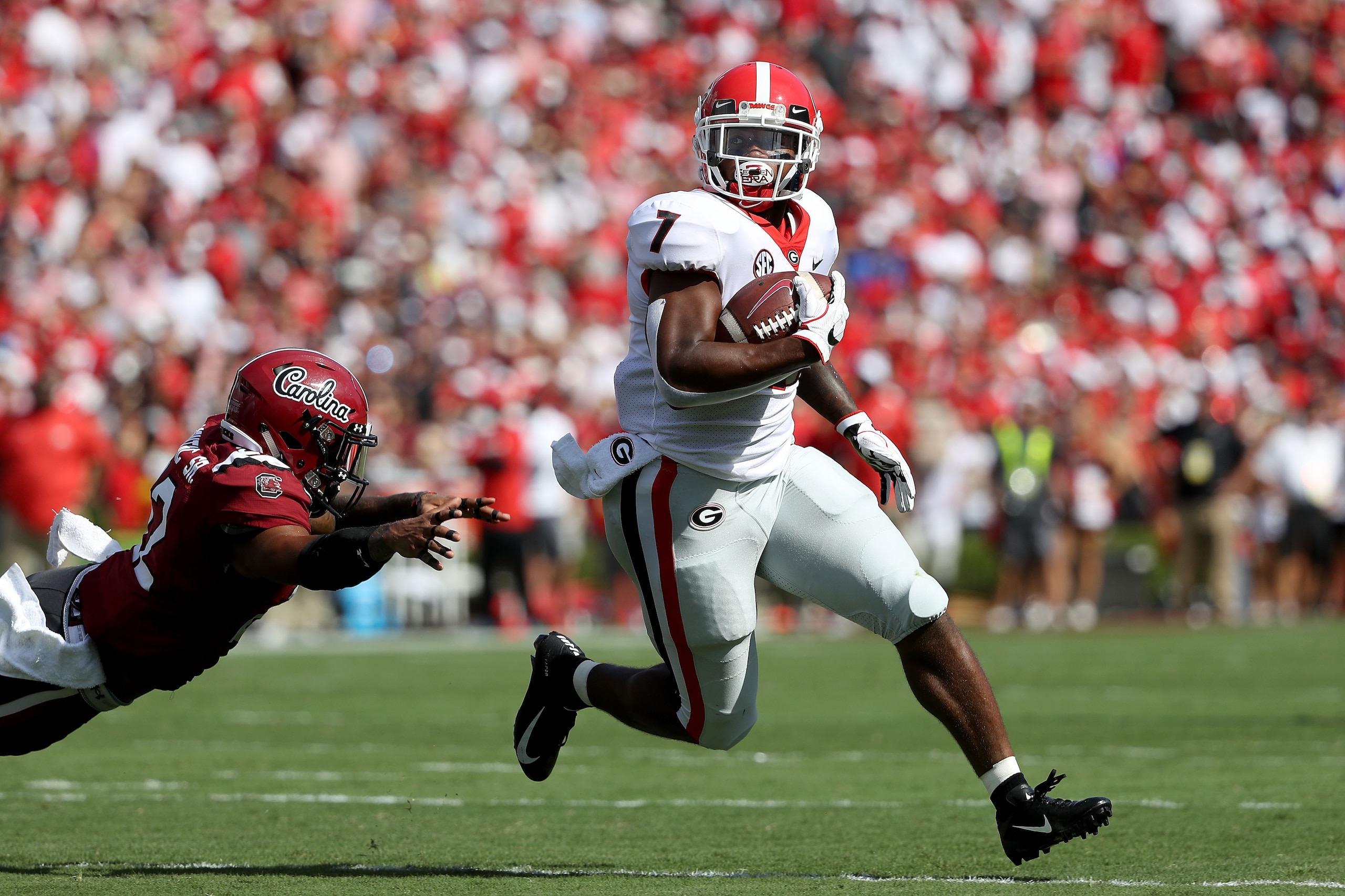 COLUMBIA, SC - SEPTEMBER 08:  Steven Montac #22 of the South Carolina Gamecocks cannot stop D'Andre Swift #7 of the Georgia Bulldogs on his way to scoring a touchdown during their game at Williams-Brice Stadium on September 8, 2018 in Columbia, South Caro