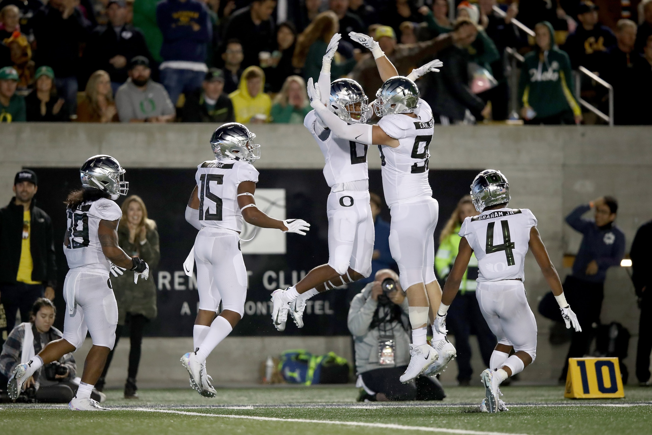 BERKELEY, CA - SEPTEMBER 29:  Jevon Holland #8 is congratulated by Drayton Carlberg #90 of the Oregon Ducks after he intercepted the ball in the endzone against the California Golden Bears at California Memorial Stadium on September 29, 2018 in Berkeley, 
