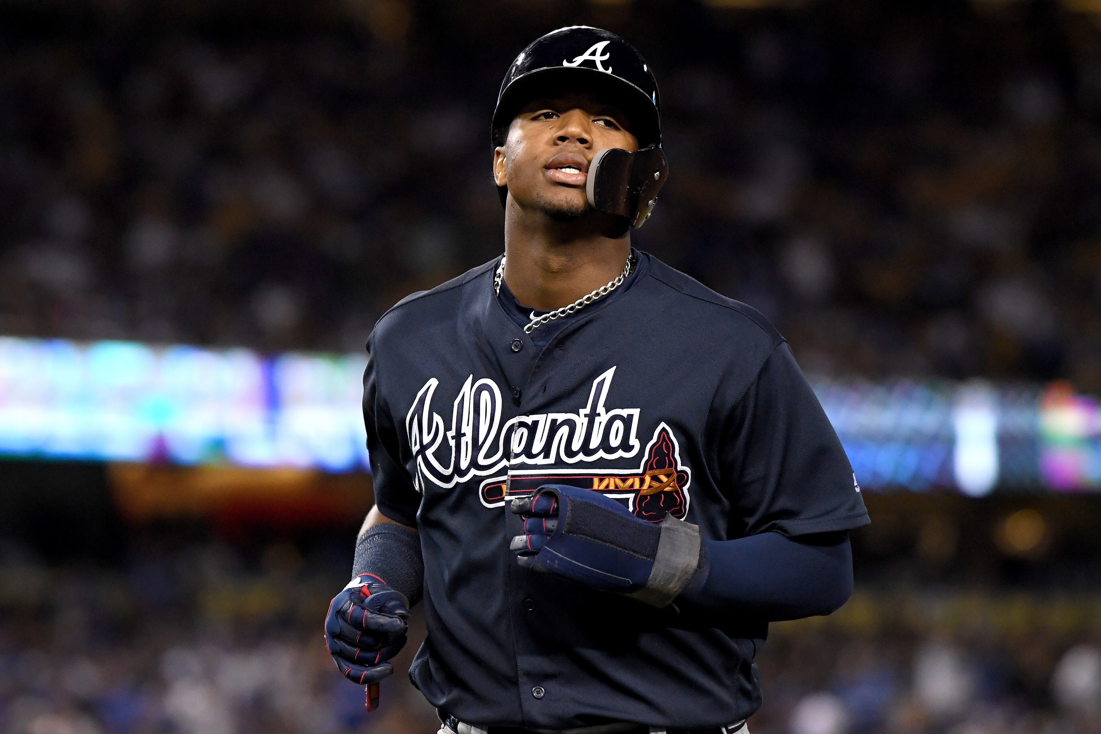 LOS ANGELES, CA - OCTOBER 04:  Ronald Acuna Jr. #13 of the Atlanta Braves reacts after being caught stealing during the sixth inning against the Los Angeles Dodgers during Game One of the National League Division Series at Dodger Stadium on October 4, 201