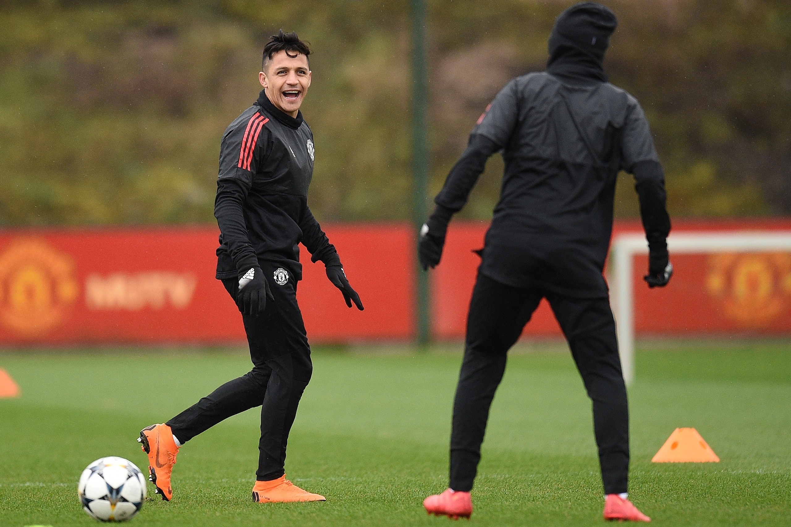 Manchester United's Chilean striker Alexis Sanchez (L) amnd Manchester United's Spanish midfielder Juan Mata attend a team training session at the club's training complex near Carrington, west of Manchester in north west England on March 12, 2018, on the 