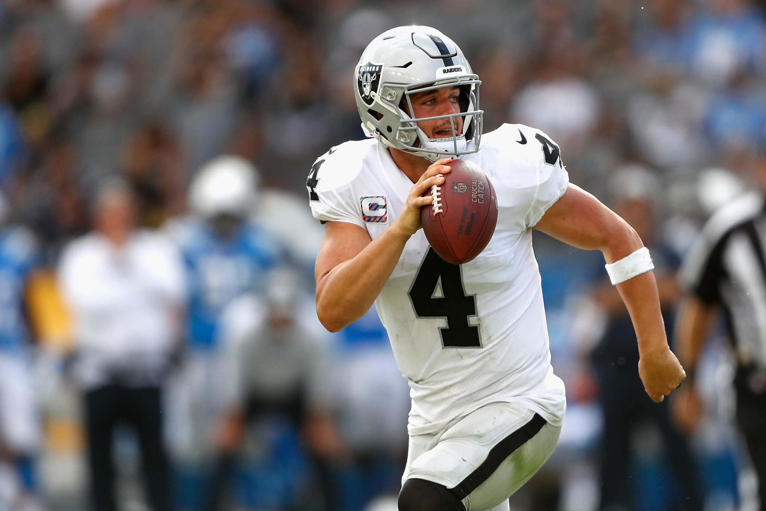 CARSON, CA - OCTOBER 07:  Derek Carr #4 of the Oakland Raiders runs out of the pocket during the second half of a game against the Los Angeles Chargers at StubHub Center on October 7, 2018 in Carson, California.  (Photo by Sean M. Haffey/Getty Images)