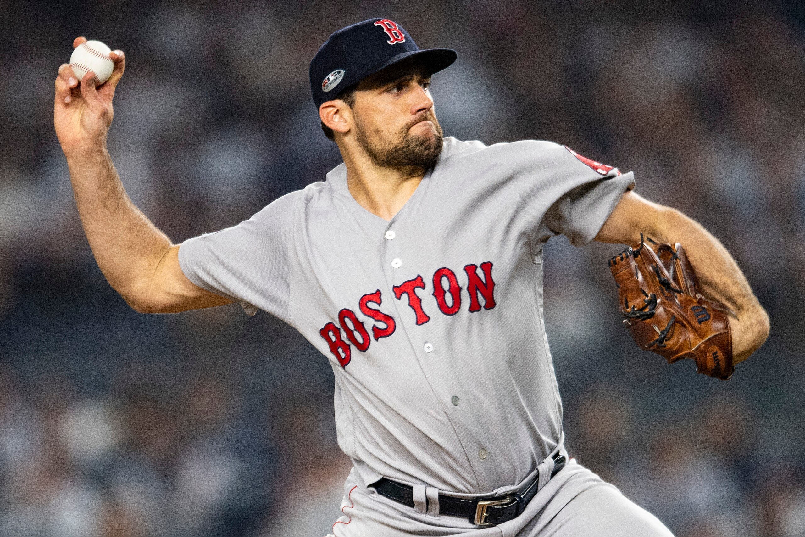 NEW YORK, NY - OCTOBER 8: Nathan Eovaldi #17 of the Boston Red Sox delivers during the first inning of game three of the American League Division Series against the New York Yankees on October 8, 2018 at Yankee Stadium in the Bronx borough of New York Cit