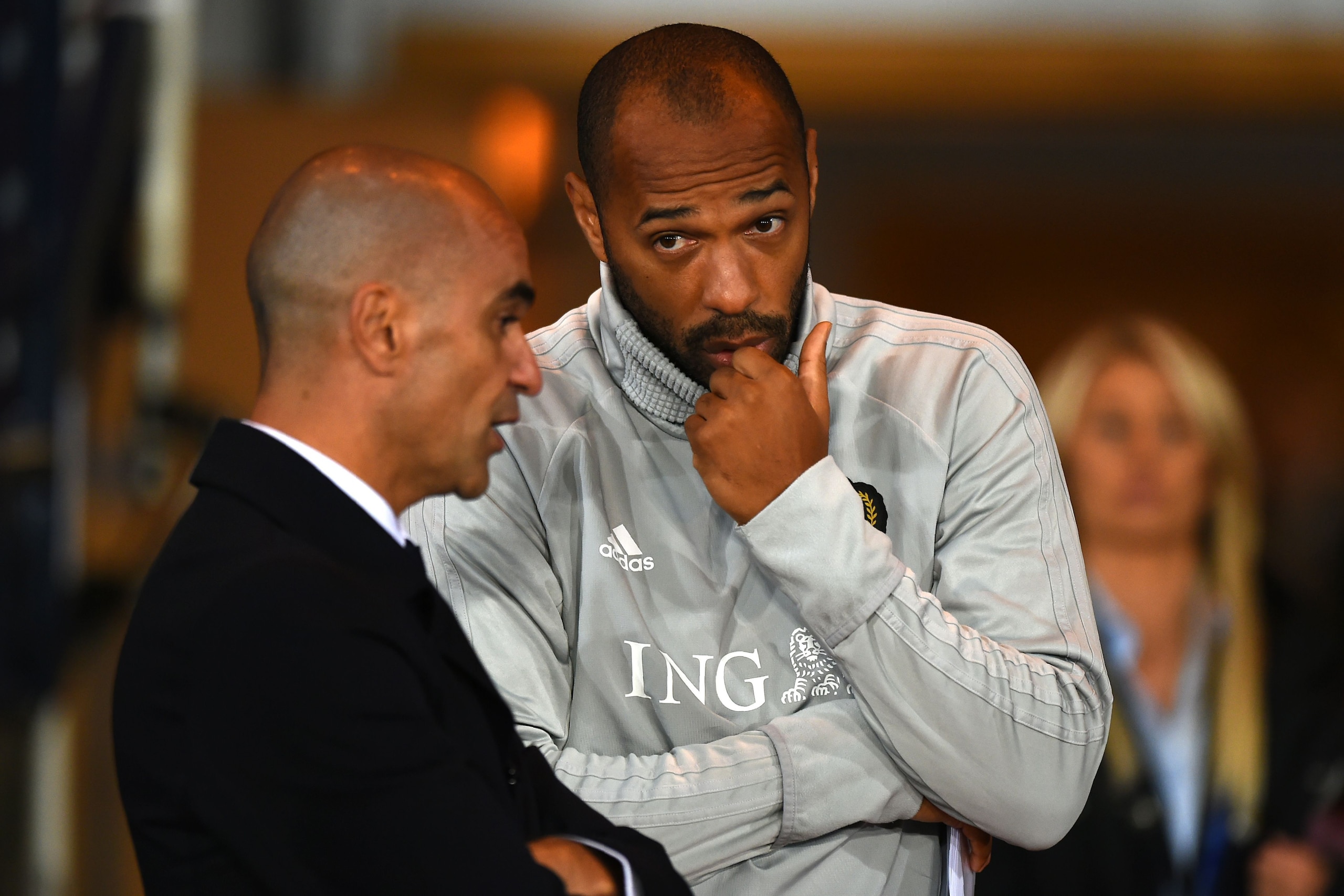 Belgium's coach Roberto Martinez (L) speaks with Belgium's French assistant coach Thierry Henry after the International friendly football match between Scotland and Belgium at Hampden Park in Glasgow, Scotland on September 7, 2018. - Belgium won the game 