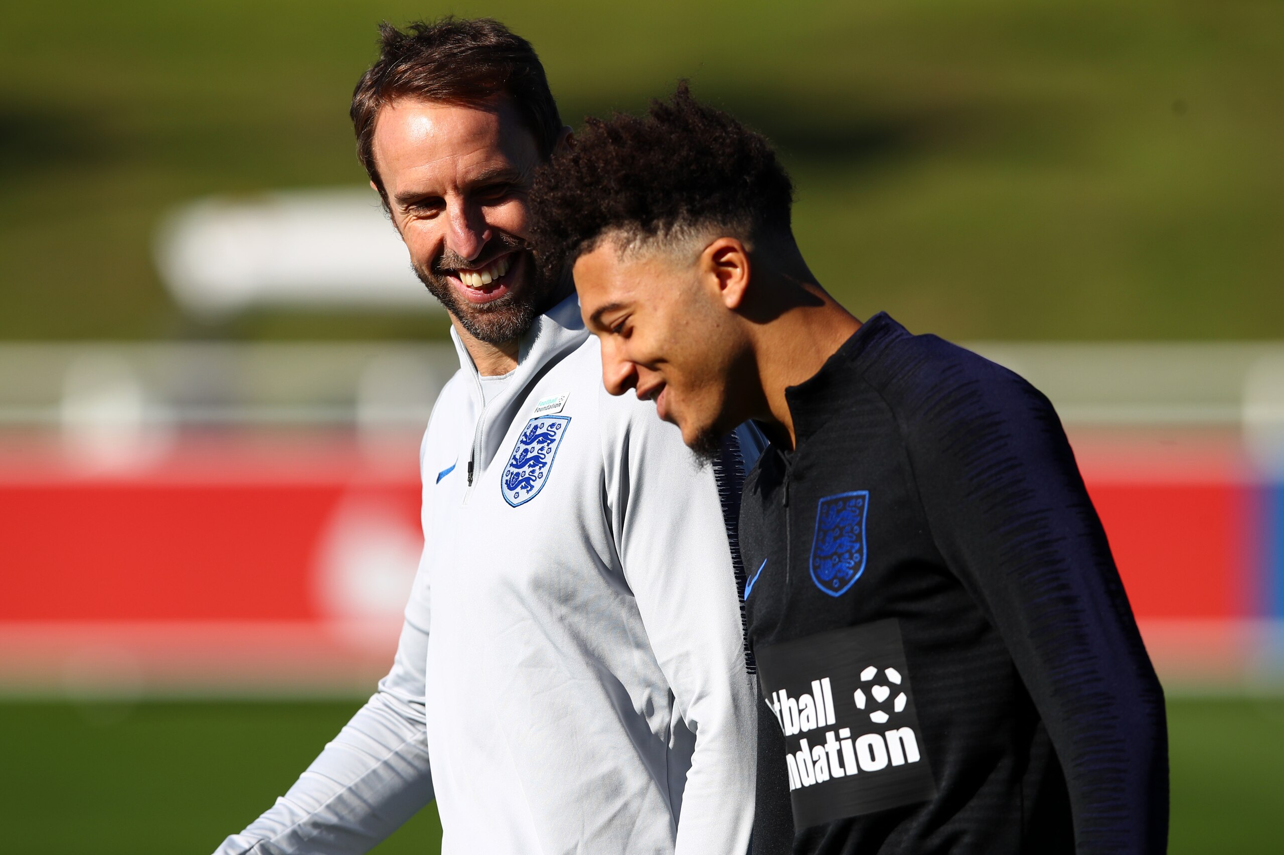 BURTON-UPON-TRENT, ENGLAND - OCTOBER 09:  Gareth Southgate speaks to Jadon Sancho during an England Training Session at St Georges Park on October 9, 2018 in Burton-upon-Trent, England.  (Photo by Clive Brunskill/Getty Images)